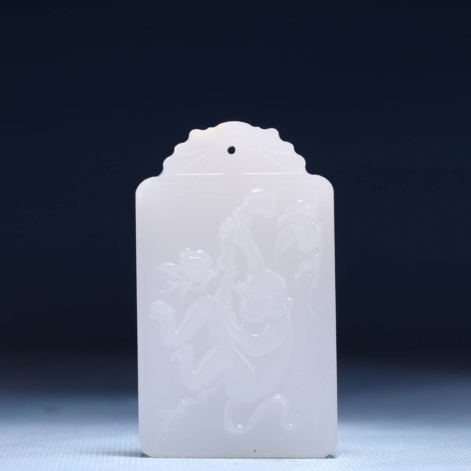 An Exquisite White Jade Monkey Patten Pendant: An Exquisite White Jade Monkey Patten Pendant,Size:1.4inx0.4inx2.4in,Weight:45g 白玉猴纹牌