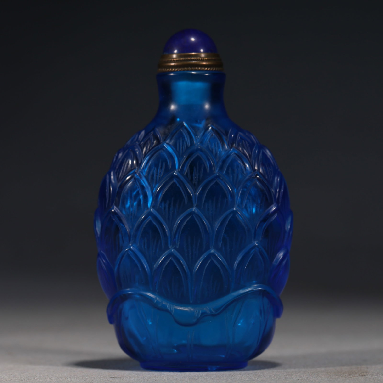 An Exquisite Blue Glass Snuff Bottle With Lotus Petal Pattern (1 of 6)
