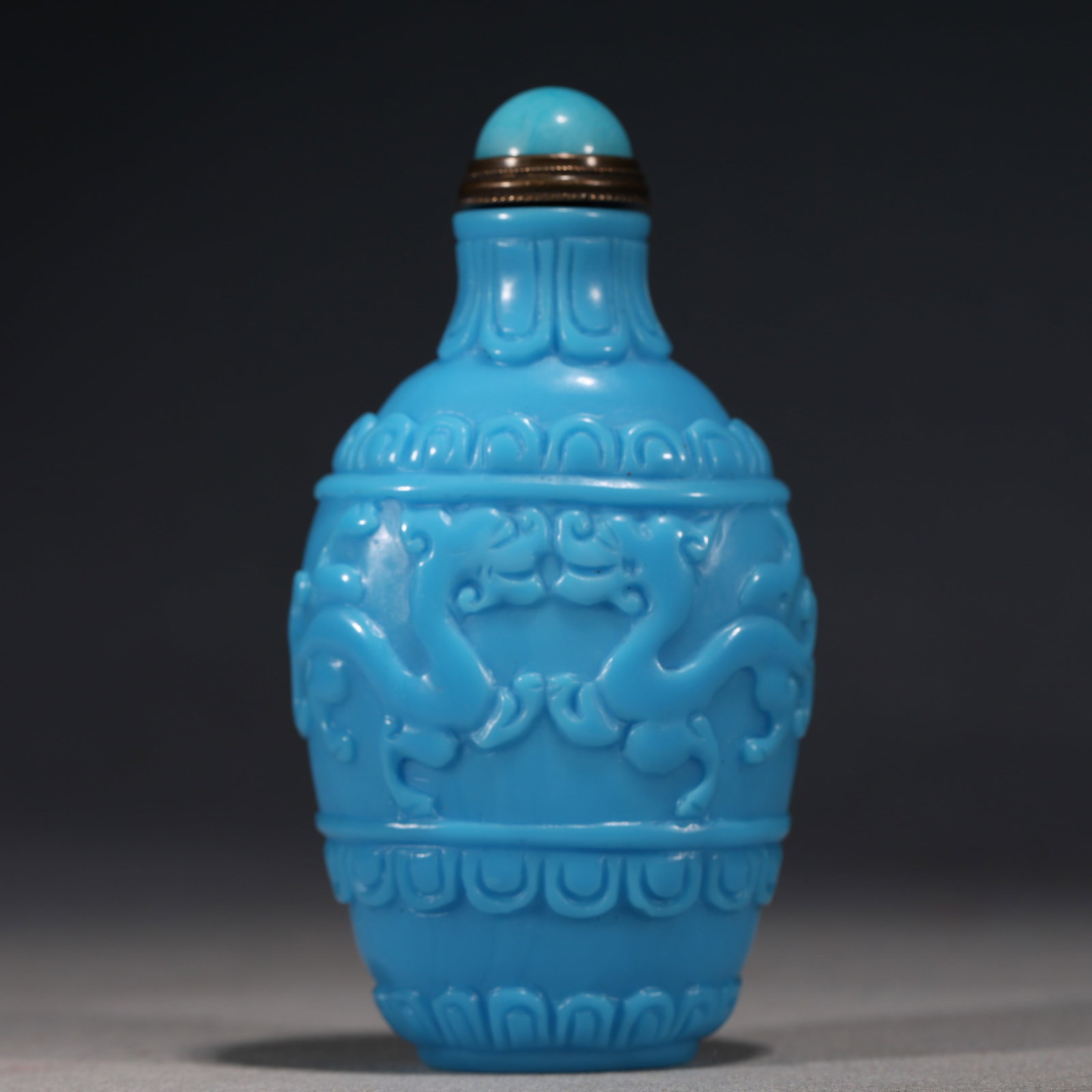 An Exquisite Blue Glass Snuff Bottle With Dragon Pattern: An Exquisite Blue Glass Snuff Bottle With Dragon Pattern,China,Qing Dynasty,Four-Character Qianlong Mark,Dimensions:3.3inx1.8in,蓝琉璃龙纹鼻烟壶,中
