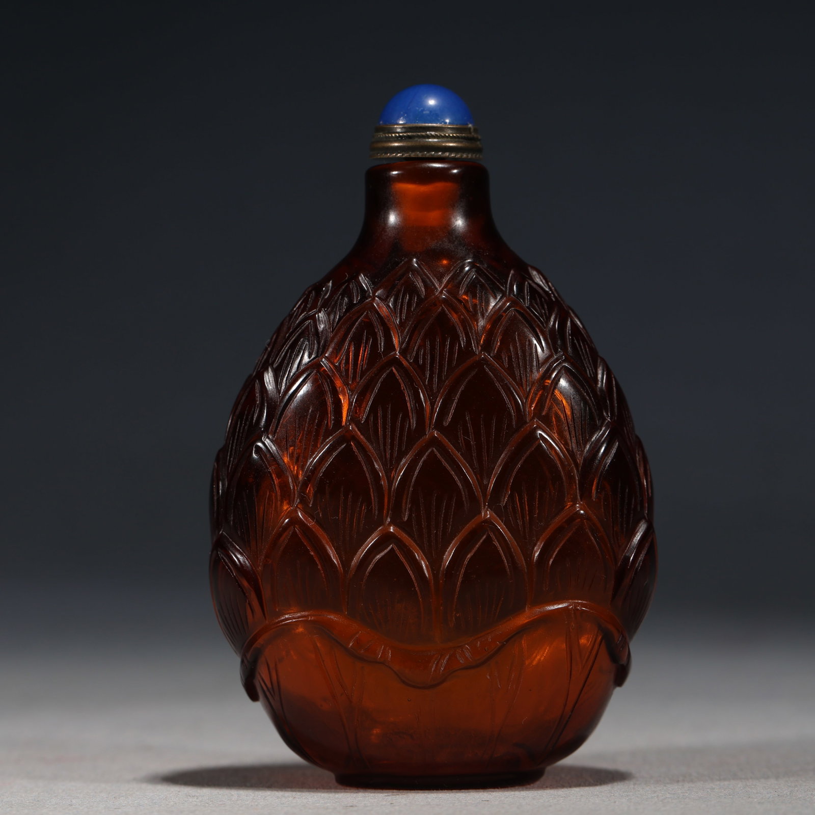 An Exquisite Brown Glass Snuff Bottle With Lotus Petal Pattern: An Exquisite Brown Glass Snuff Bottle With Lotus Petal Pattern,China,Qing Dynasty,Dimensions:3.1inx2in,褐琉璃莲瓣纹鼻烟壶,中国清