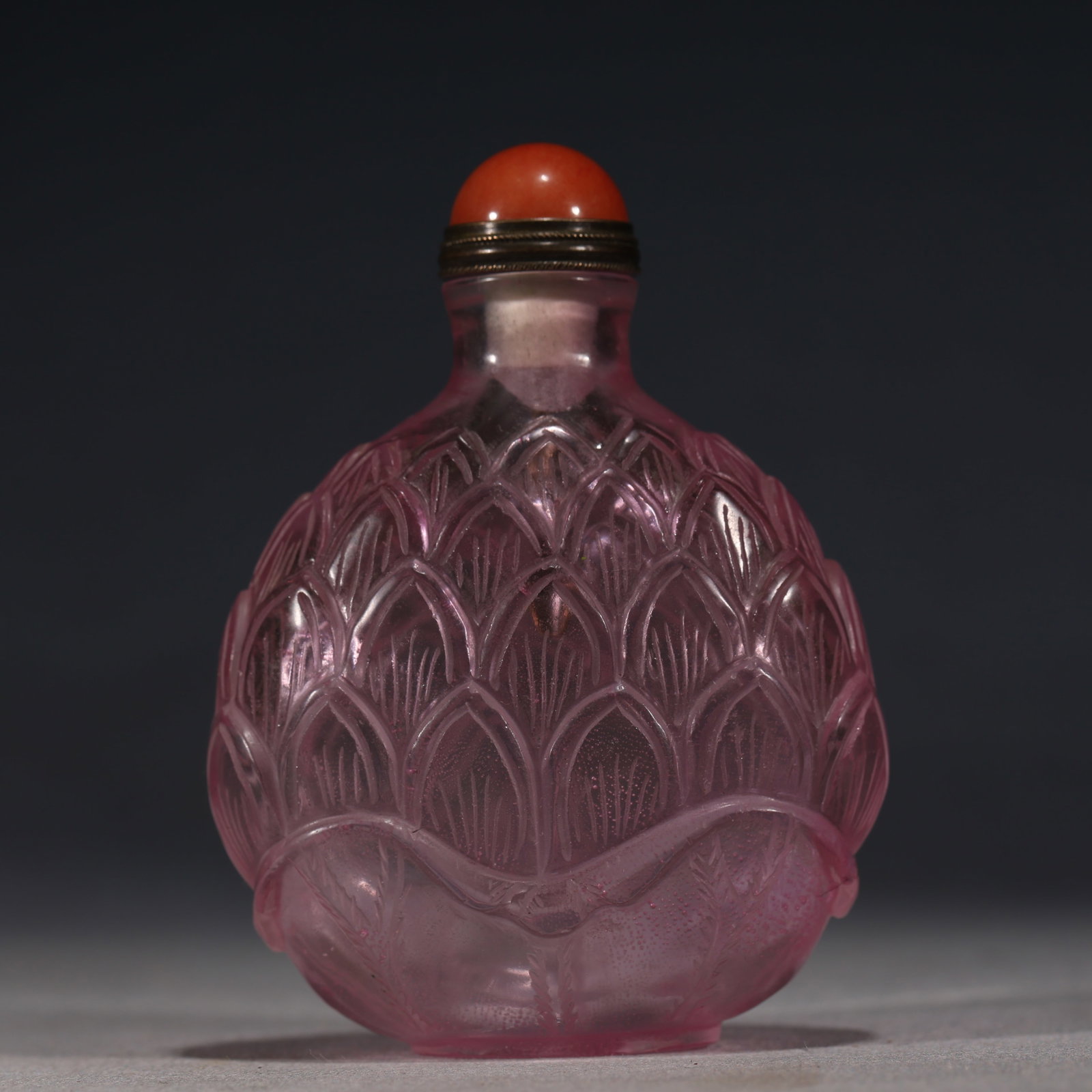 An Exquisite Pink Glass Snuff Bottle With Lotus Petal Pattern: An Exquisite Pink Glass Snuff Bottle With Lotus Petal Pattern,China,Qing Dynasty,Dimensions:3.1inx2.4in,粉琉璃莲瓣纹鼻烟壶,中国清