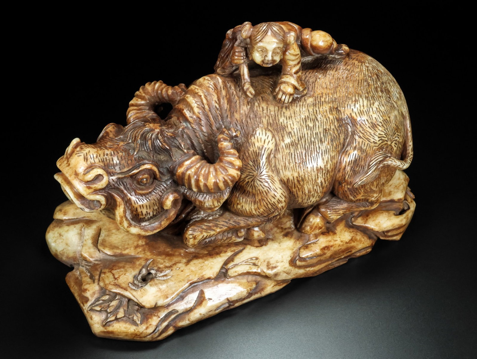 An Exquisite White Jade Figure Riding Buffalo Ornament: An Exquisite White Jade Figure Riding Buffalo Ornament