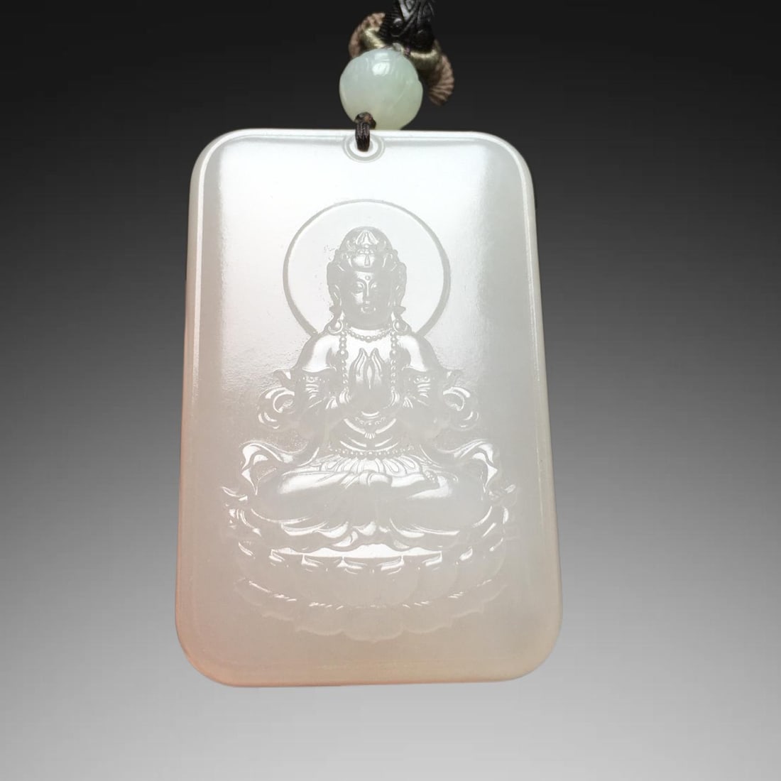 An Exquisite Hotan Jade Avalokitesvara Pendant: An Exquisite Hotan Jade Avalokitesvara Pendant,Qing Dynasty, China,Size:2.3inx1.5inx0.5in,Weight:65g 和田玉观音挂件,中国清代