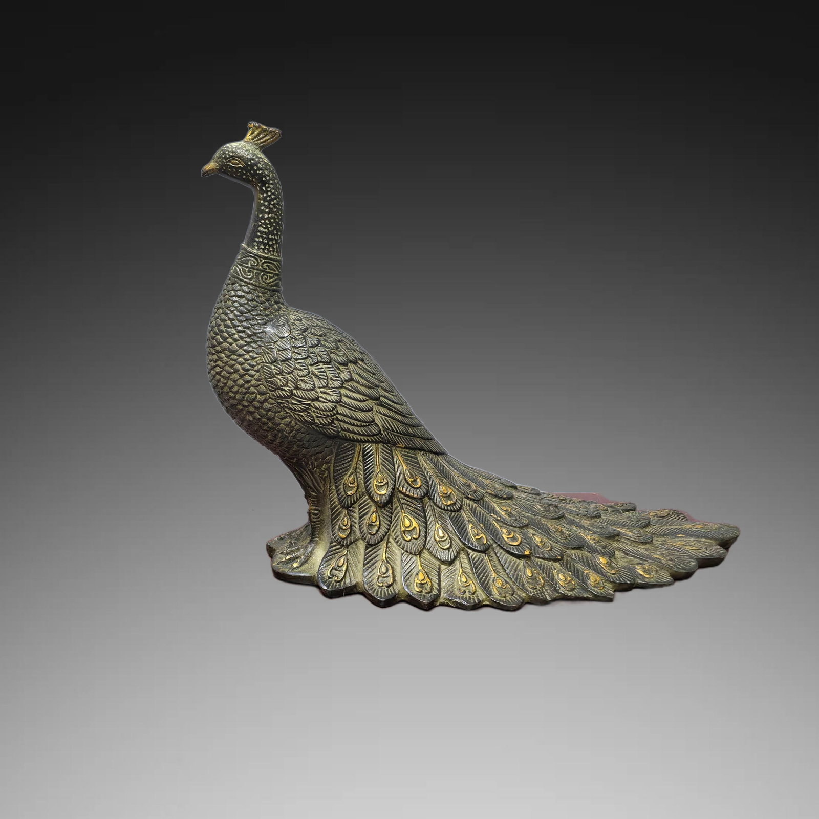 An Exquisite Gilt Bronze Peacock Ornament: An Exquisite Gilt Bronze Peacock Ornament,Ming Dynasty, China,Size:10.2inx4.7inx8.3in,Weight:1800g 青铜鎏金孔雀摆件,中国明代