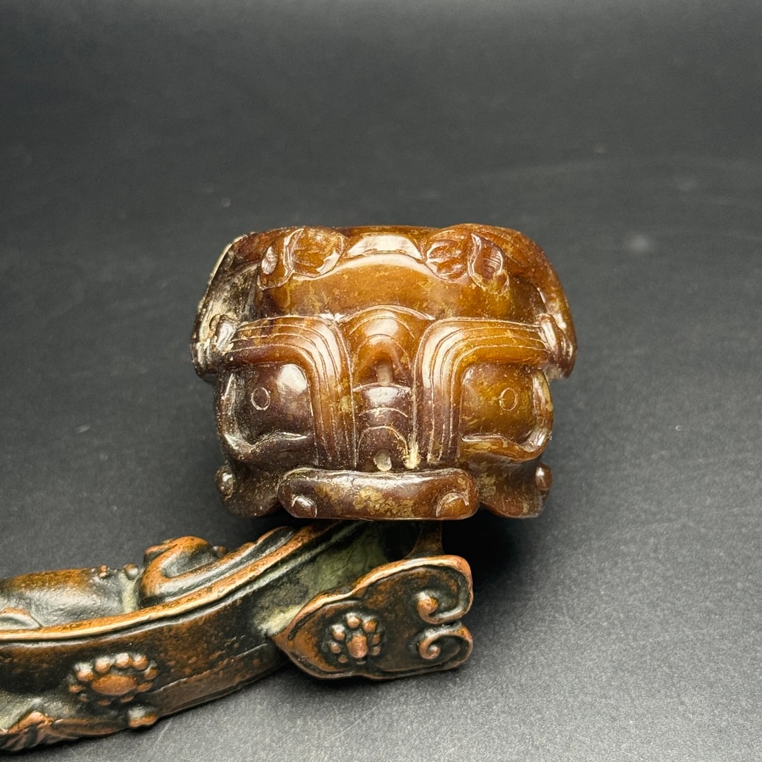 An Exquisite Hotan Jade Beast-Face Pattern Thumb Ring: An Exquisite Hotan Jade Beast-Face Pattern Thumb Ring,Han Dynasty, China,Size:2.1inx2.2inx1.5in(Inner0.9in),Weight:156g 和田玉兽面纹扳指,中国