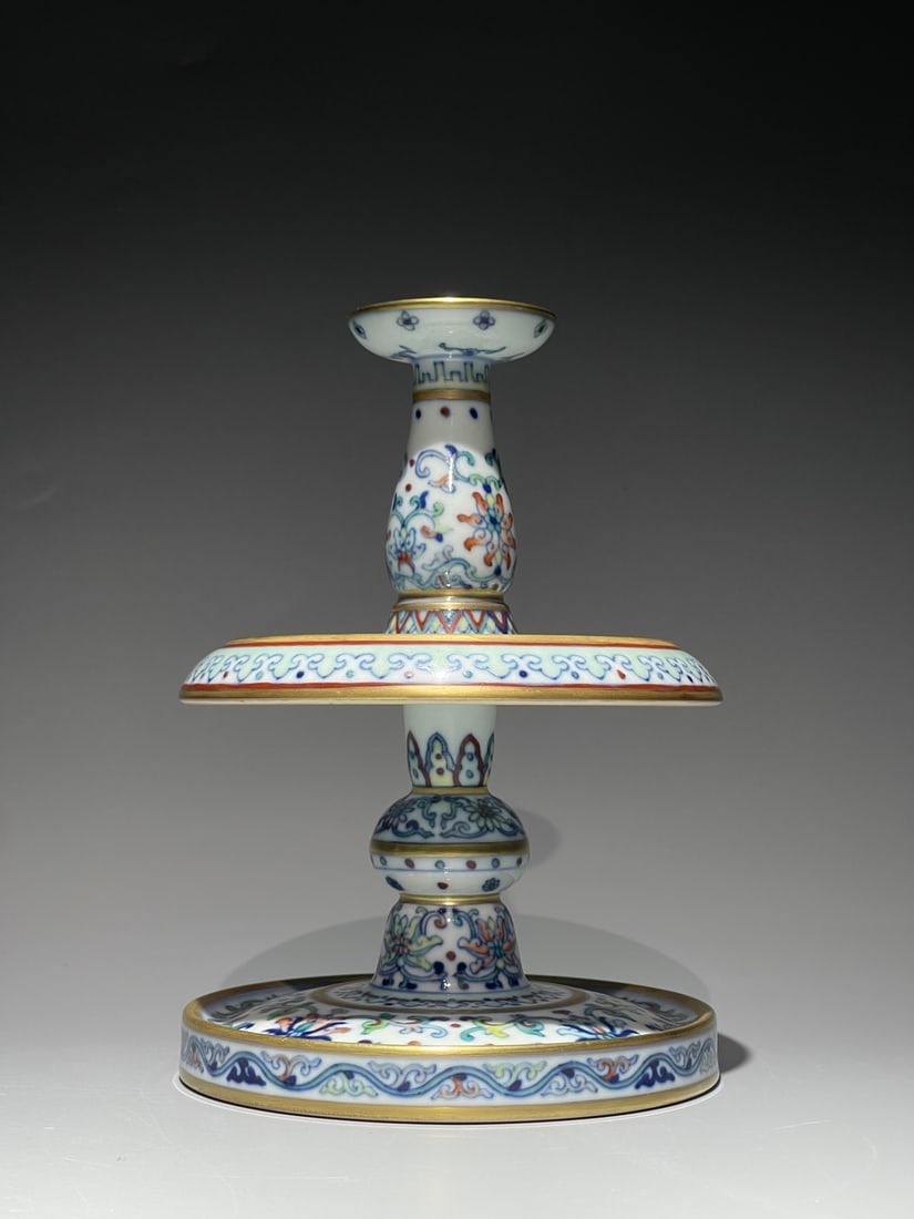 An Exquisite Doucai Painted Gold Lotus Pattern Candlestick: An Exquisite Doucai Painted Gold Lotus Pattern Candlestick,Qing Dynasty, China,Qianlong Four-character Mark,Size:6.9inx4.7in 斗彩描金缠枝莲纹烛