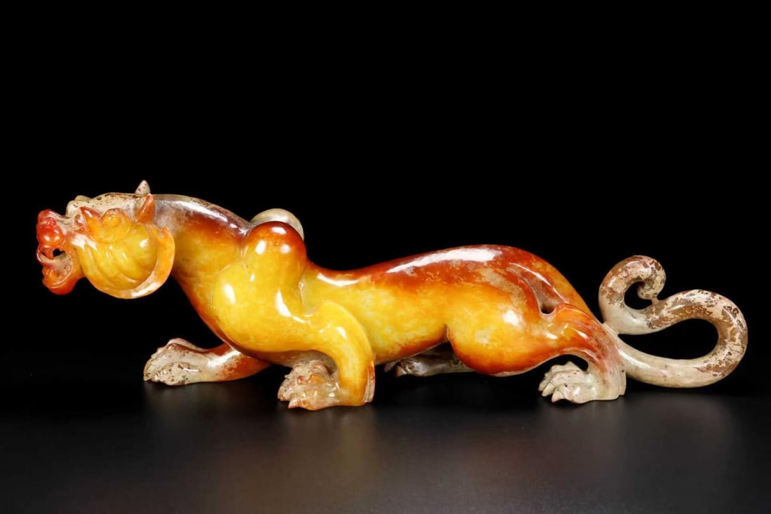 An Exquisite Hotan Jade Auspicious Beast Ornament: An Exquisite Hotan Jade Auspicious Beast Ornament,Han Dynasty, China,Size:11.8inx2inx3.9in,Weight:1045.5g 和田玉瑞兽摆件,中国汉代