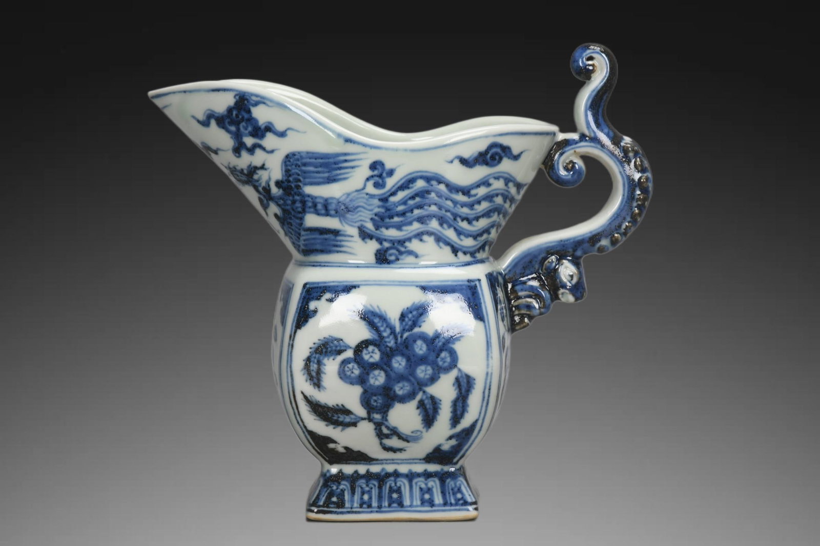 An Exquisite Blue and White Phoenix Pattern Jue Cup: An Exquisite Blue and White Phoenix Pattern Jue Cup,Ming Dynasty, China,Xuande Four-character Mark,Size:7.5inx3.5inx8.3inx3in 青花凤纹爵杯,中国明&