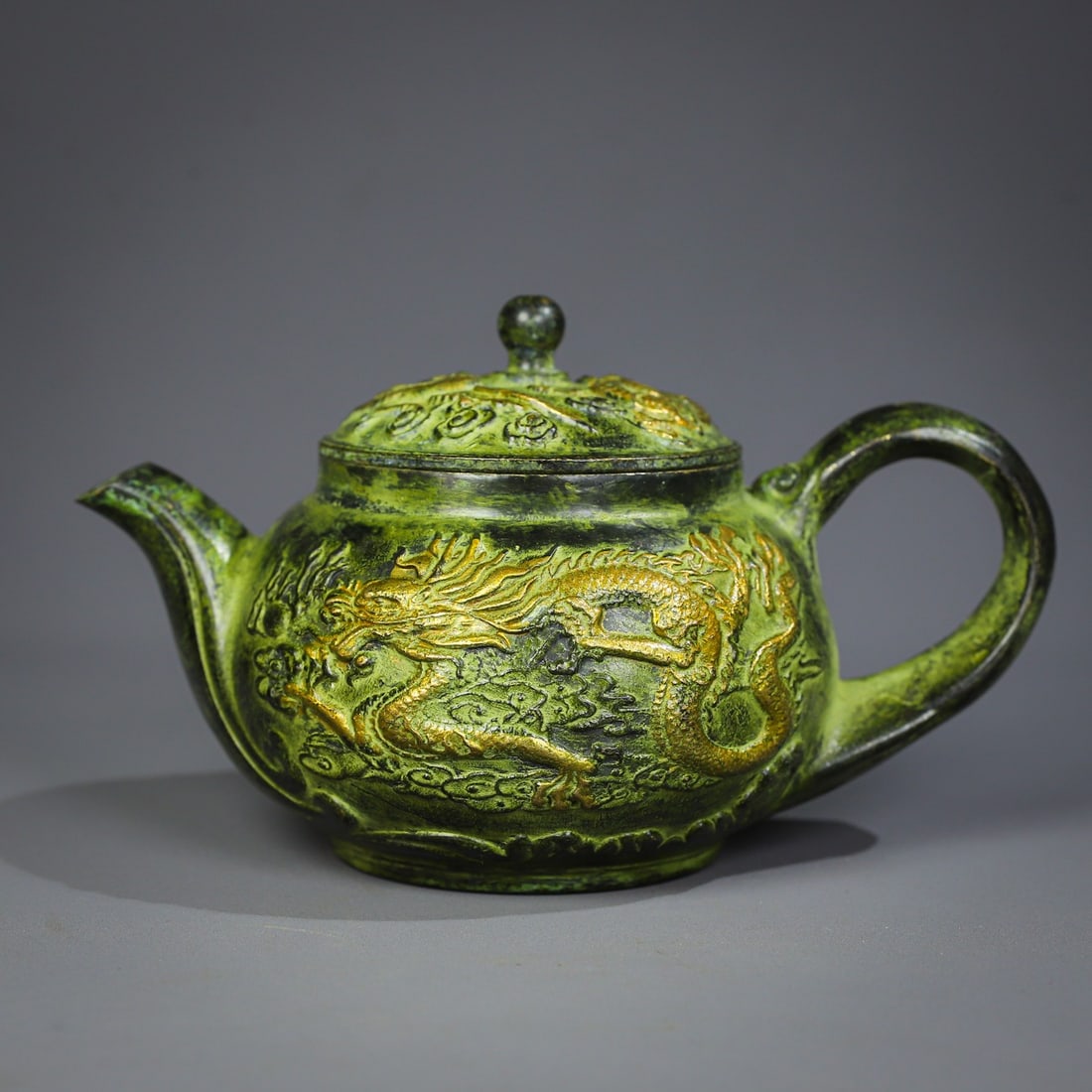 An Exquisite Bronze Dragon and Phoenix Pattern Ewer: An Exquisite Bronze Dragon and Phoenix Pattern Ewer,Qing Dynasty, China,Qianlong Four-character Mark,Size:5.5inx3.3inx3.7in,Weight:651g 铜龙凤纹壶,中国清