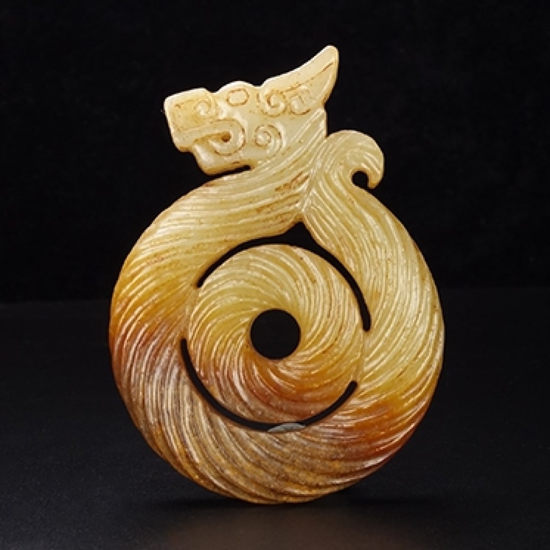 An Exquisite Hotan Jade Dragon Sword Ornament: An Exquisite Hotan Jade Dragon Sword Ornament,Han Dynasty, China,Size:3.1inx2.4inx0.4in,Weight:69.2g 和田玉龙剑饰,中国汉代
