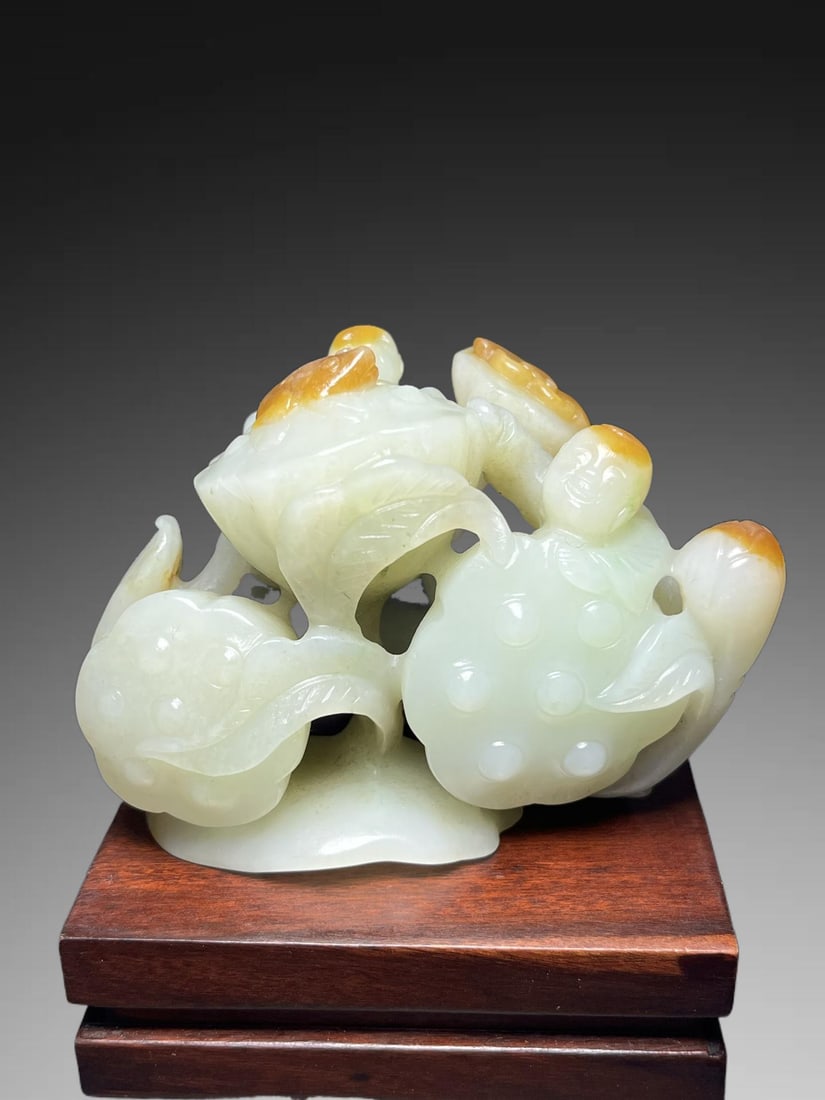 An Exquisite Hotan Jade Lotus Handheld Carving: An Exquisite Hotan Jade Lotus Handheld Carving,Qing Dynasty, China,Size:3.5inx2.2inx2.4in,Weight:276g 和田玉莲手把件,中国清代