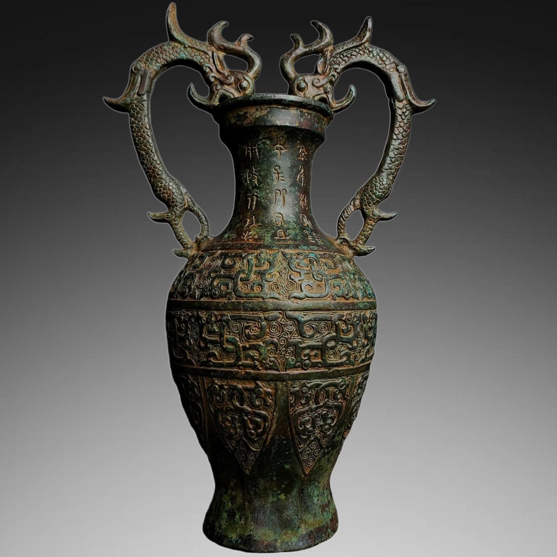 An Exquisite Bronze Dragon Head Vase: An Exquisite Bronze Dragon Head Vase,Han Dynasty, China,Size:13inx8.3in ,Weight:2300g 青铜龙首瓶,中国汉代