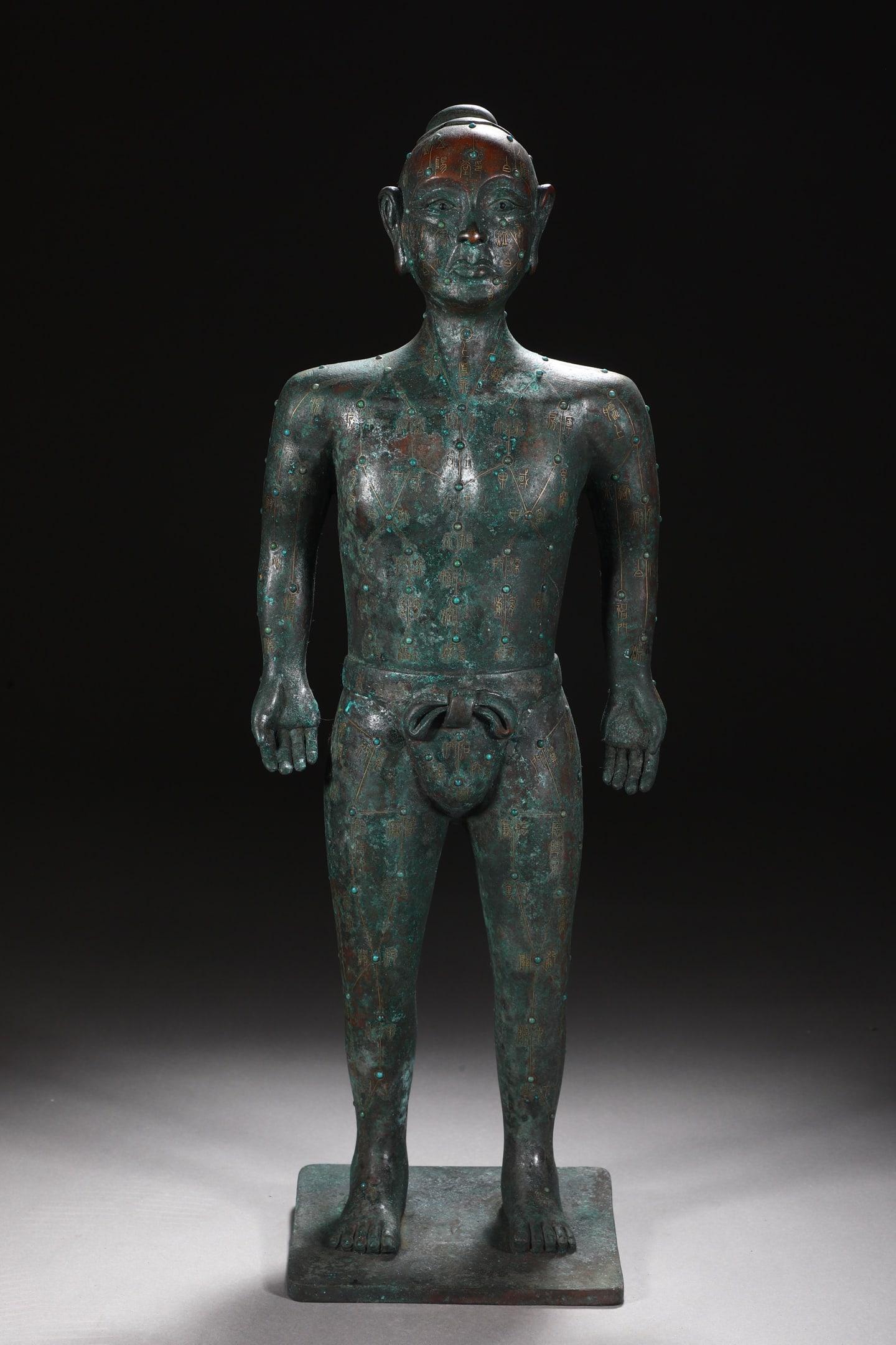 An Exquisite Bronze Figure Ornament: An Exquisite Bronze Figure Ornament,The Warring States Period in China,Size:20.3inx7.3in,Weight:6150g 青铜人物摆件,中国战国时期
