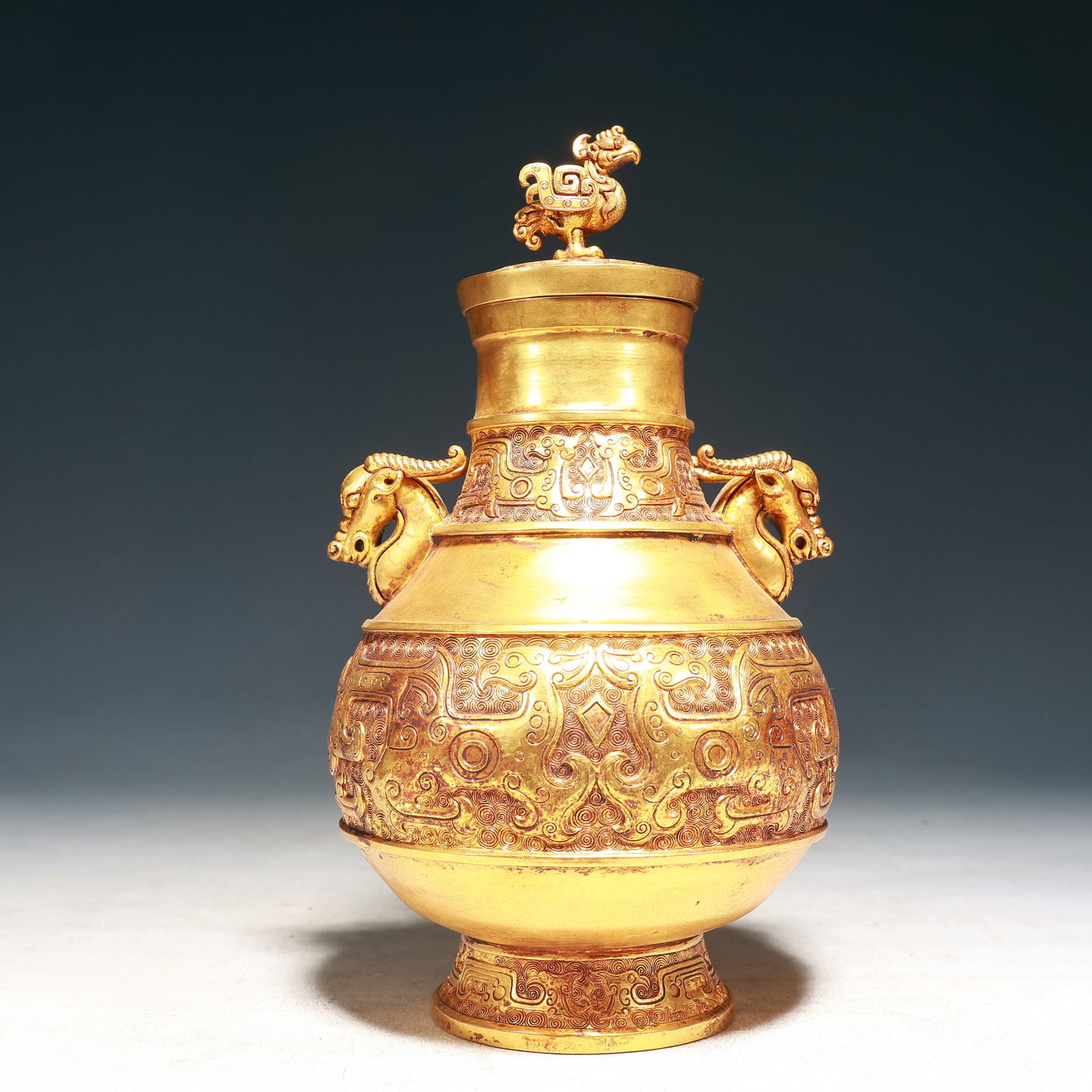 An Exquisite Gilt Bronze Phoenix Pattern Sheep-Ears Vase,with Phoenix Cover: An Exquisite Gilt Bronze Phoenix Pattern Sheep-Ears Vase,with Phoenix Cover,Qing Dynasty, China,Size:6.3inx11in,Weight:1450g