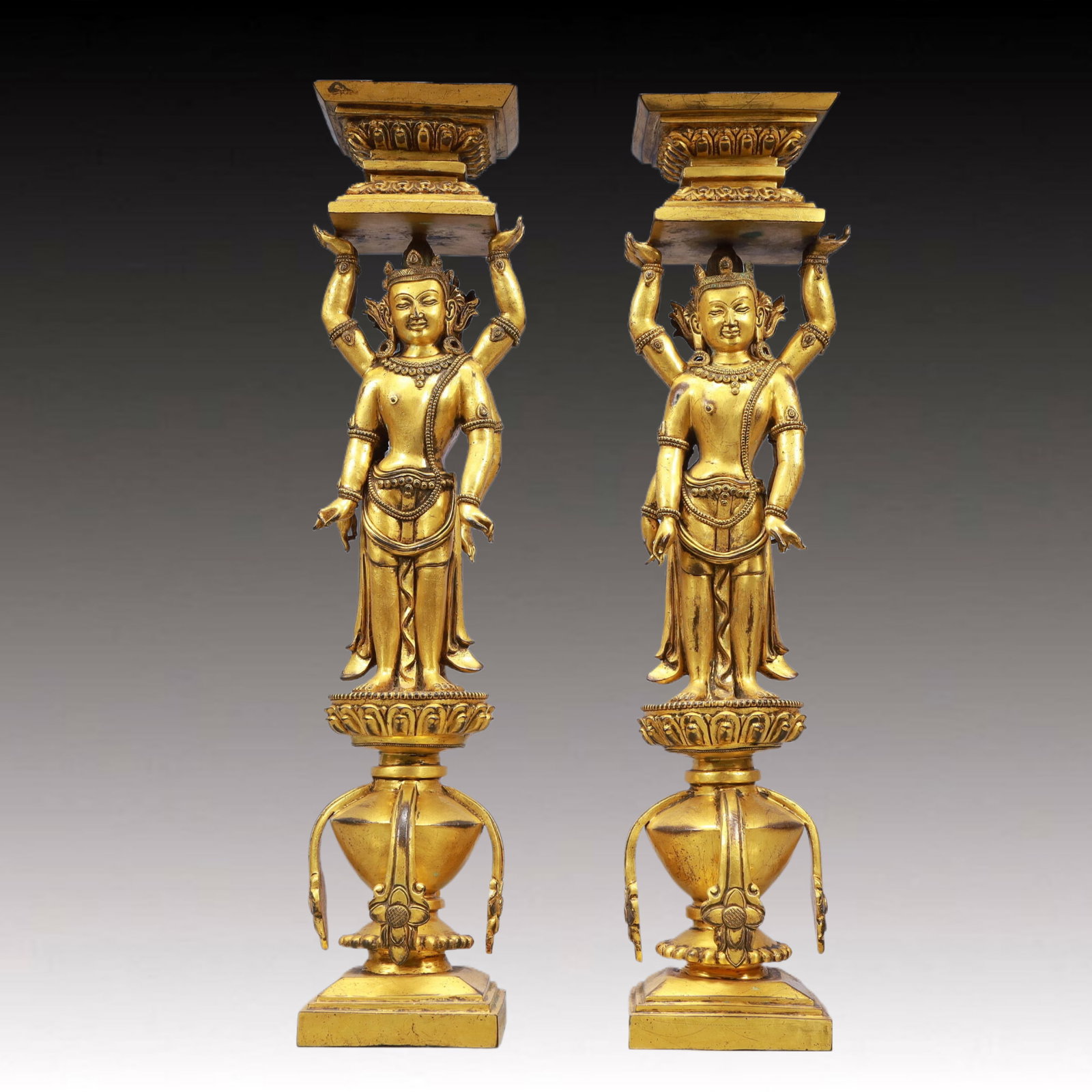 A Pair of Exquisite Gilt Bronze Statue of Bodhisattva Candlesticks: A Pair of Ecmxquisite Gilt Bronze Statue of Bodhisattva Candlesticks,Ming Dynasty, China,Size:4.7inx20.5inWeight:17900g 一对铜鎏金菩萨烛台,中