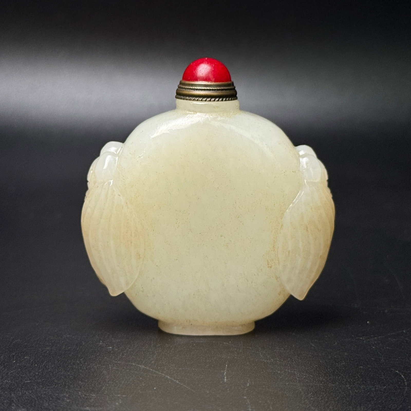 An Exquisite White Jade Cicada-Ears Snuff Bottle: An Exquisite White Jade Cicada-Ears Snuff Bottle,Qing Dynasty,China,Size:2.2inx2.5inx0.7in,Weight:86g 白玉蝉耳鼻烟壶,中国清代