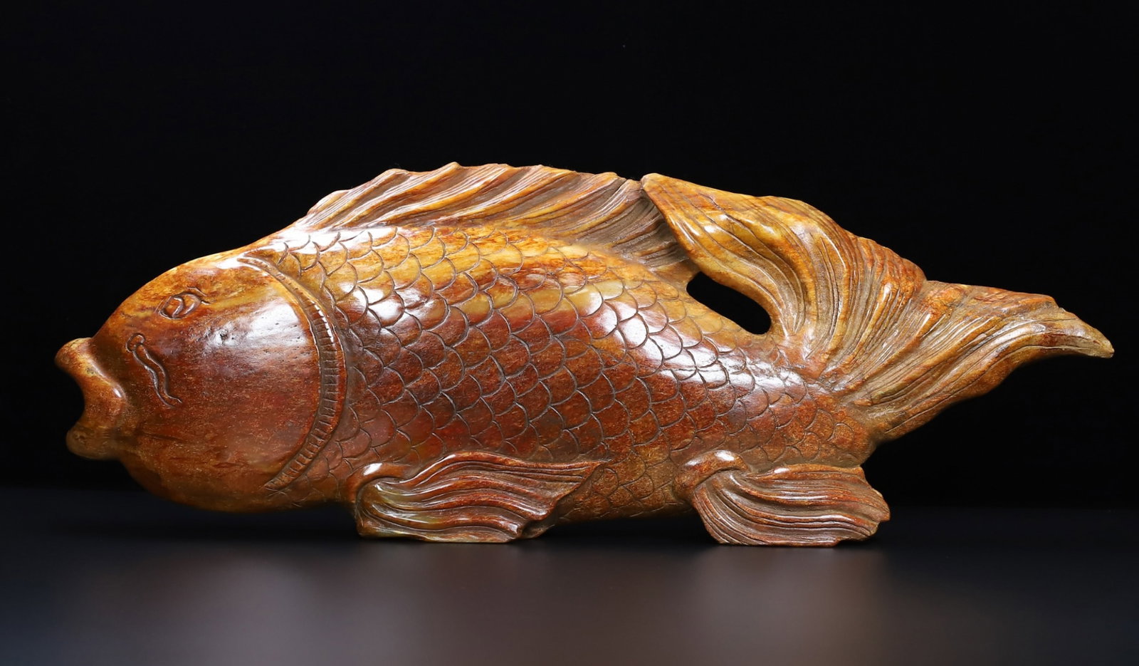 An Exquisite Archaic Jade Fish Ornament: An Exquisite Archaic Jade Fish Ornament,Ancient Time,China,Size:22.4inx7.9inx2in,Weight:8250g 高古玉鱼摆件,中国远古时期