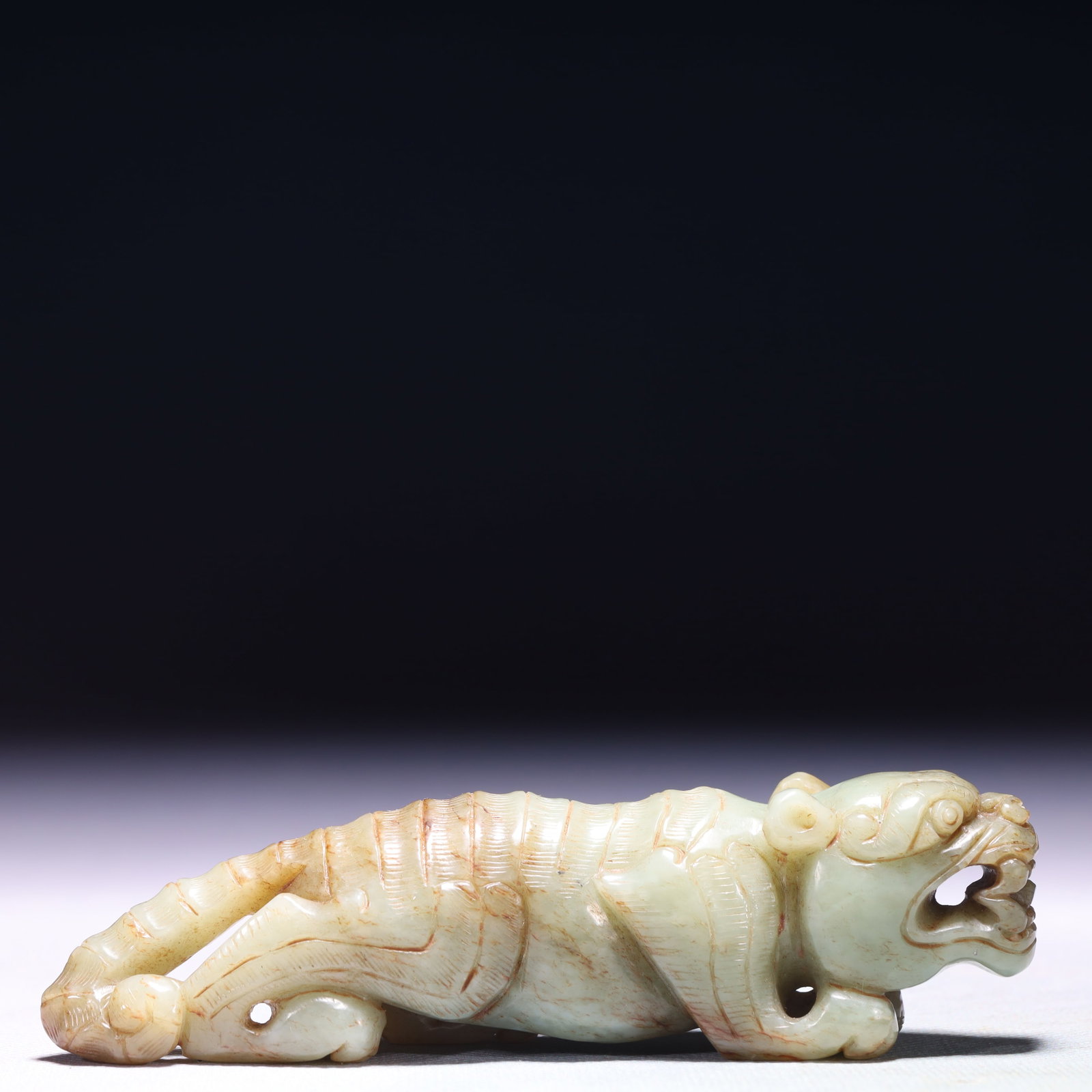 An Exquisite White Jade Tiger Ornament: An Exquisite White Jade Tiger Ornament,Qing Dynasty,China,Size:4.9inx1.2inx1.6in,Weight:185.8g 白玉老虎摆件,中国清代