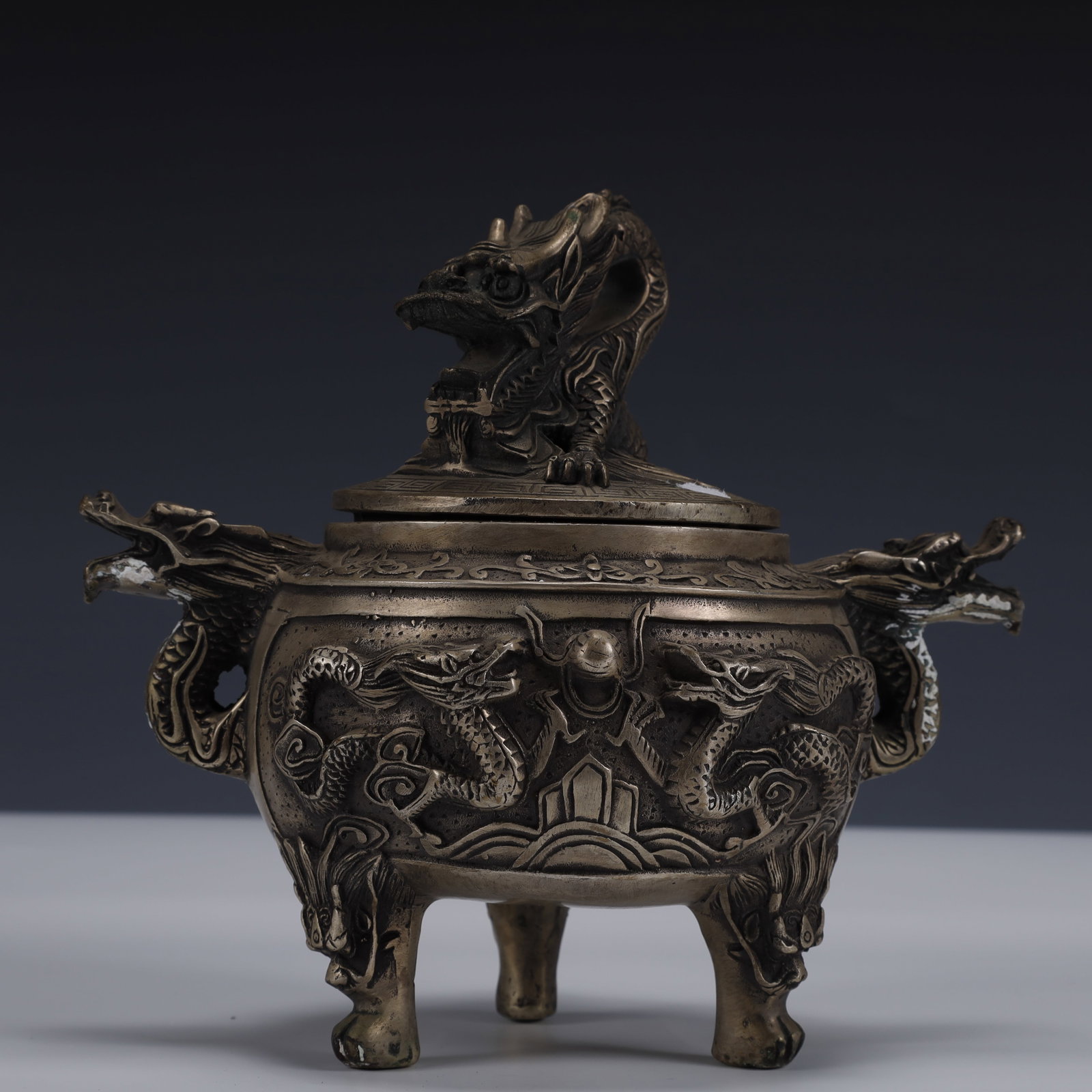 An Exquisite Silver-Plated Bronze Dragon Pattern Double-Ears and Tripod Censer: An Exquisite Silver-Plated Bronze Dragon Pattern Double-Ears and Tripod Censer ,Ming Dynasty, China,Xuande Six-character Mark,Size:7.9inx5.9inx7.1in,Weight:1150g 铜镀银龙ಬ