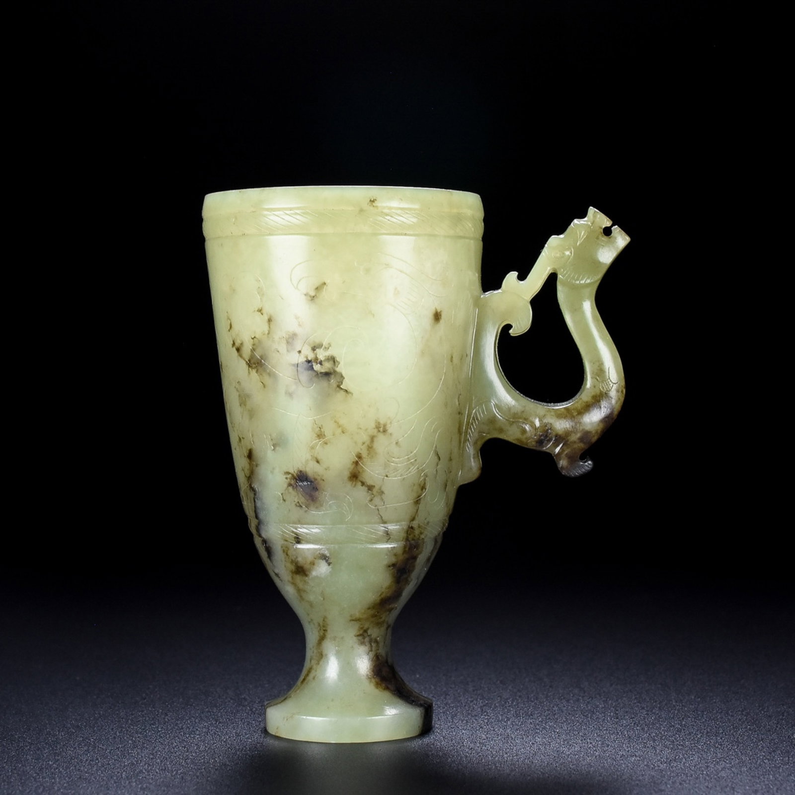 An Archaic Gaogu yu Dragon Pattern Cup: An Archaic Gaogu yu Dragon Pattern Cup,Ancient Time, China, Size:3.3inx2.2inx4.1in, Weight:169g 高古玉龙纹杯,中国远古时期,