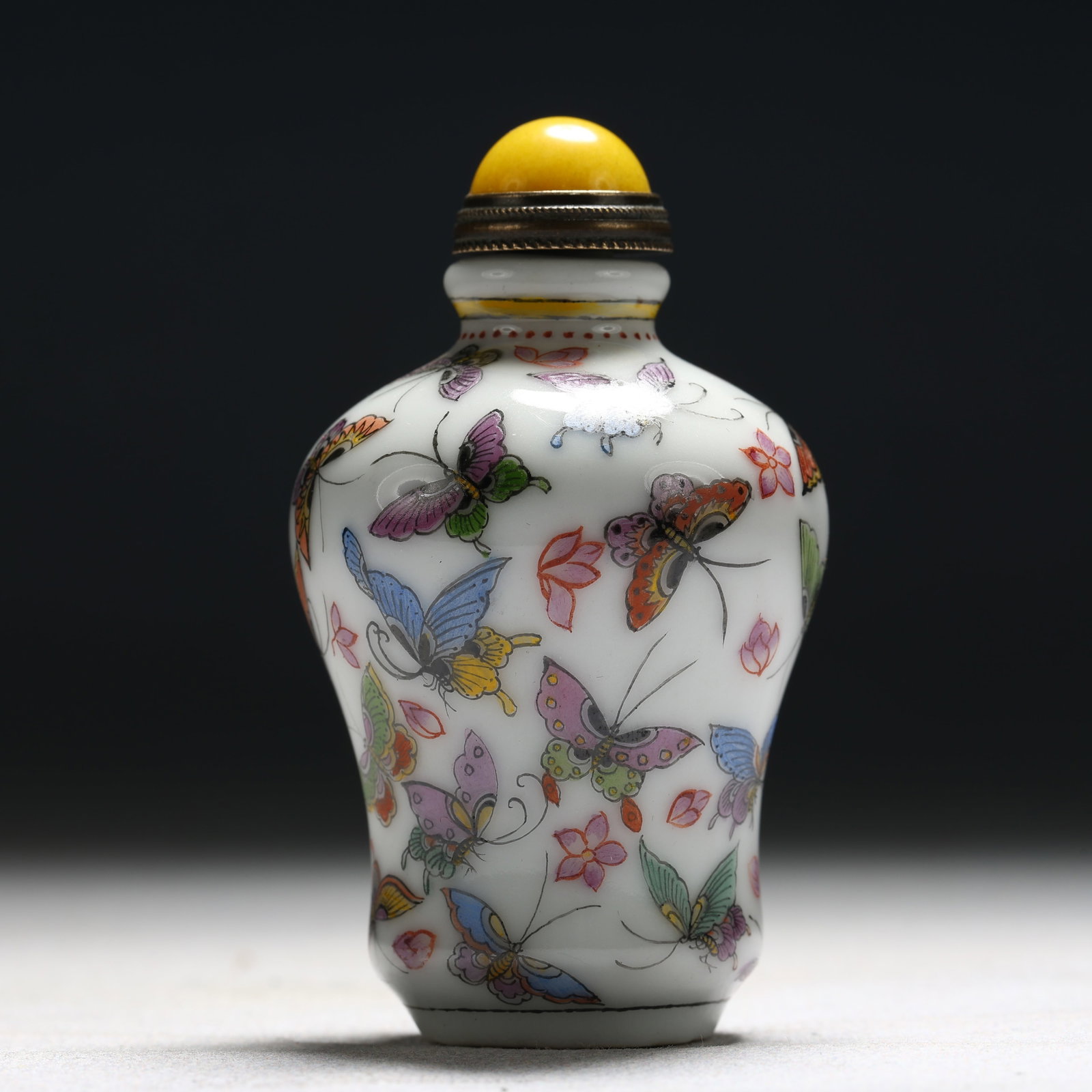 An Exquisite Enamel Flower and Butterfly Pattern Porcelain Snuff Bottle: An Exquisite Enamel Flower and Butterfly Pattern Porcelain Snuff Bottle,Qing Dynasty, China,Kangxi Four-character Mark,Size:1.6inx1.6inx3in 瓷胎画珐琅彩花