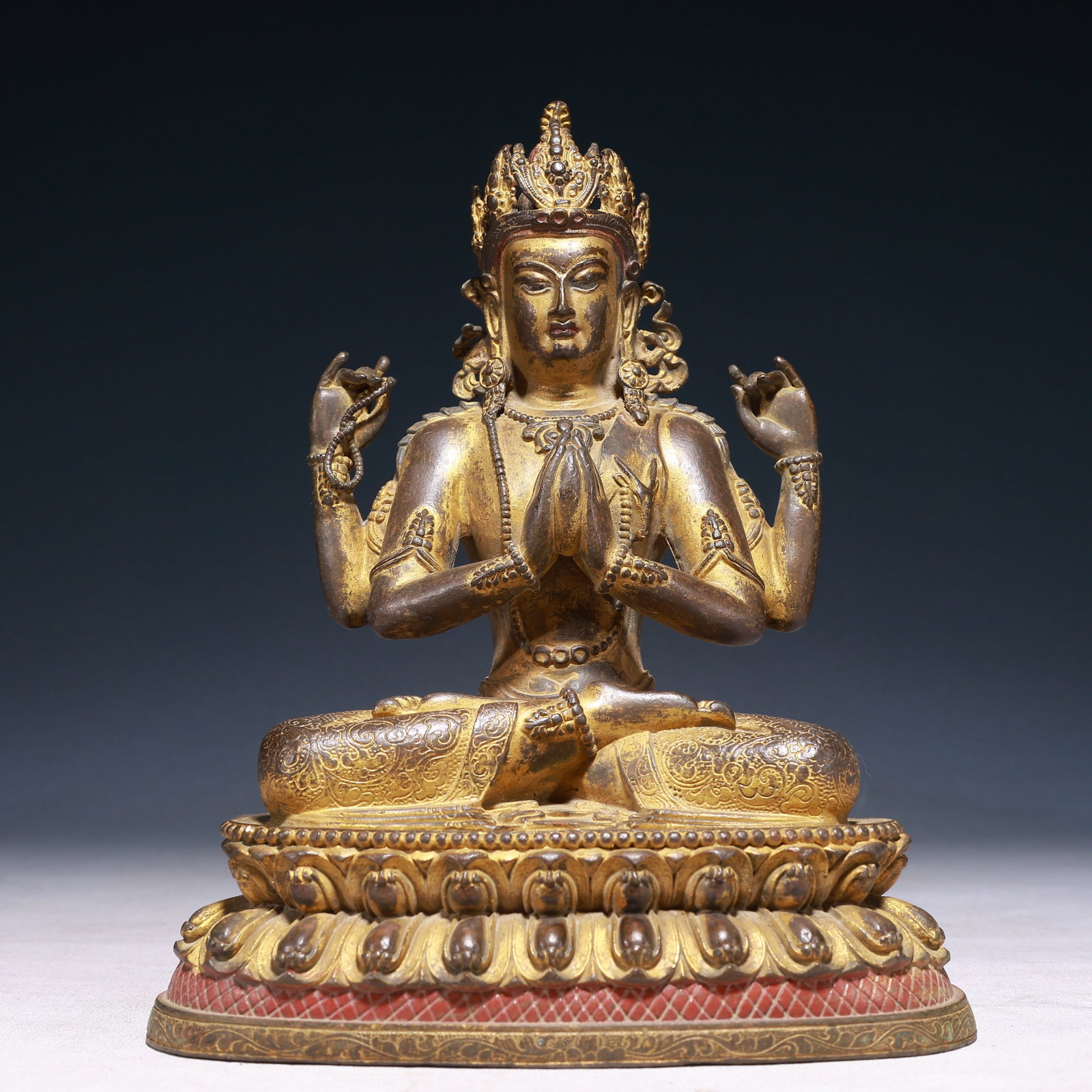 A Solemn Gilt Bronze Statue of Four-arms Avalokitesvara: A Solemn Gilt Bronze Statue of Four-arms Avalokitesvara,Qing Dynasty,China,Size:7.5inx5.5inx9.8in,Weight:3050g 铜鎏金四臂观音像,中国清
