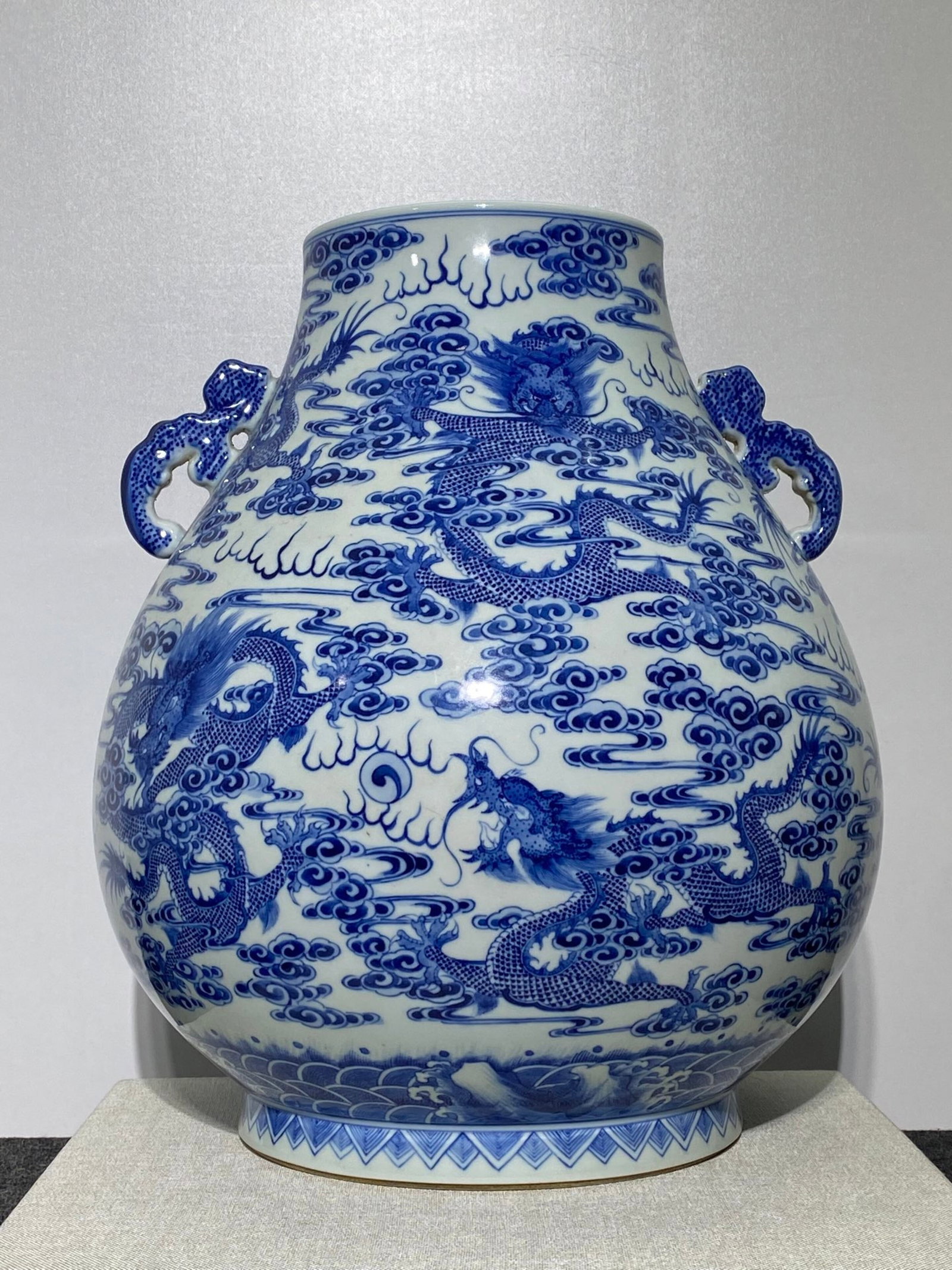 A Rare Blue and White Auspicious Cloud and Dragon Pattern Double-Ears Vase: A Rare Blue and White Auspicious Cloud and Dragon Pattern Double-Ears Vase,Qing Dynasty,China,Qianlong Six-character Mark,Size:15inx13.8in 青花祥云龙纹双ň