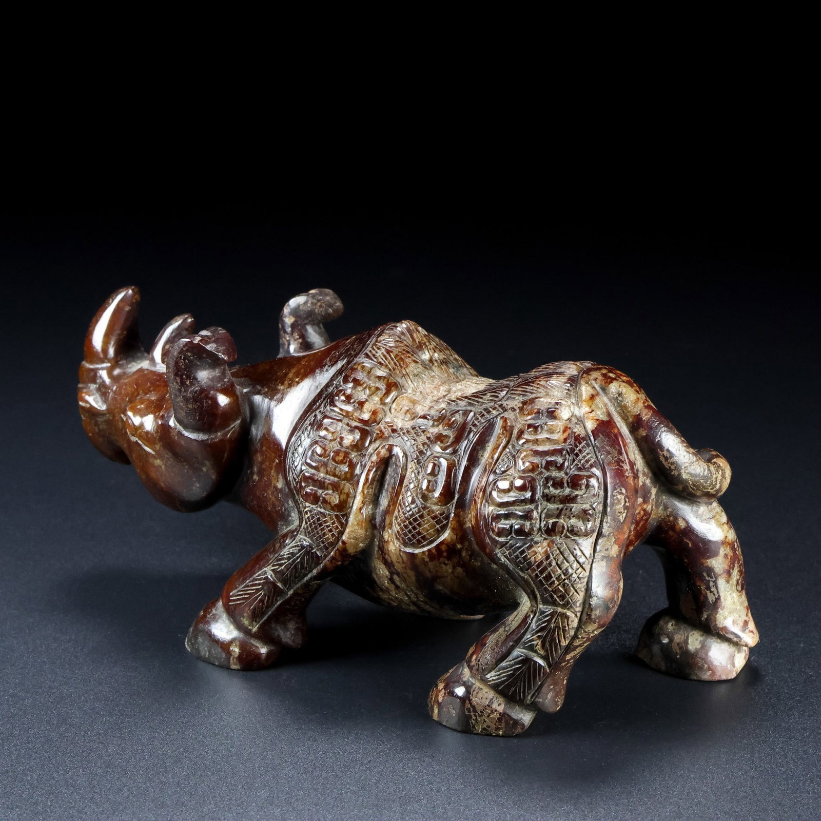 An Exquisite Archaic Jade Rhinoceros Ornament: An Exquisite Archaic Jade Rhinoceros Ornament,Ancient Time,China,Size:6.3inx3.1inx2.8in,Weight:610g