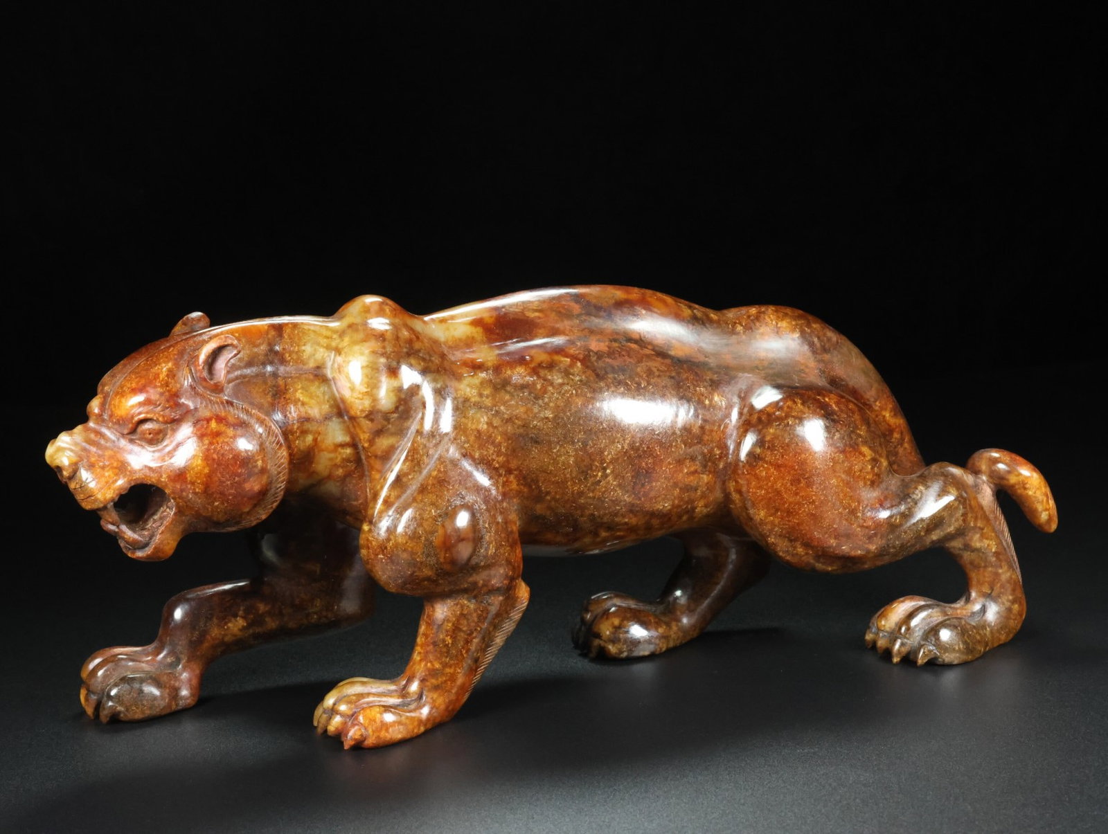 An Exquisite Archaic Jade Tiger Ornament (1 of 9)