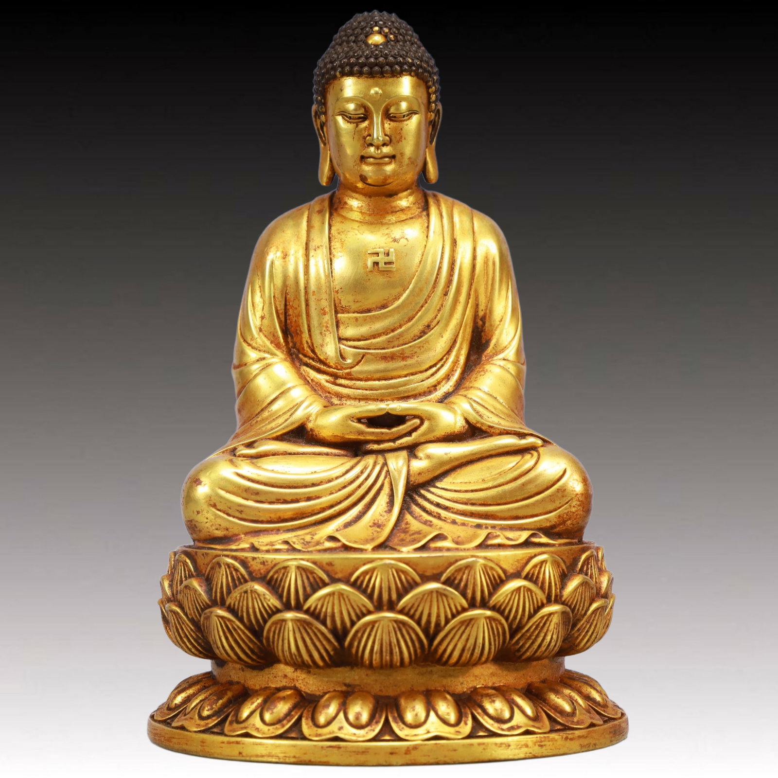 A Solemn Gilt Bronze Statue of Sakyamuni: A Solemn Gilt Bronze Statue of Sakyamuni,Ming Dynasty, China,Yongle Six-character Mark,Size:3.9inx3.3inx6.3in,Weight:2150g