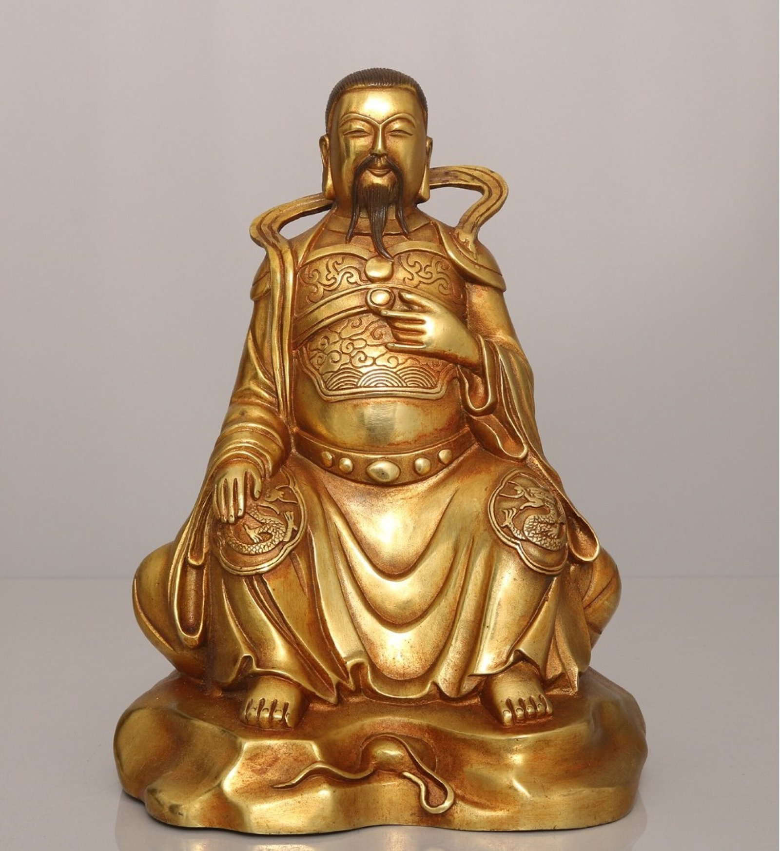 A Solemn Gilt Bronze Figure Ornament: A Solemn Gilt Bronze Figure Ornament,Qing Dynasty,China,Size:9.3inx7.1in,Weight:2250g 铜鎏金人物摆件,中国清代