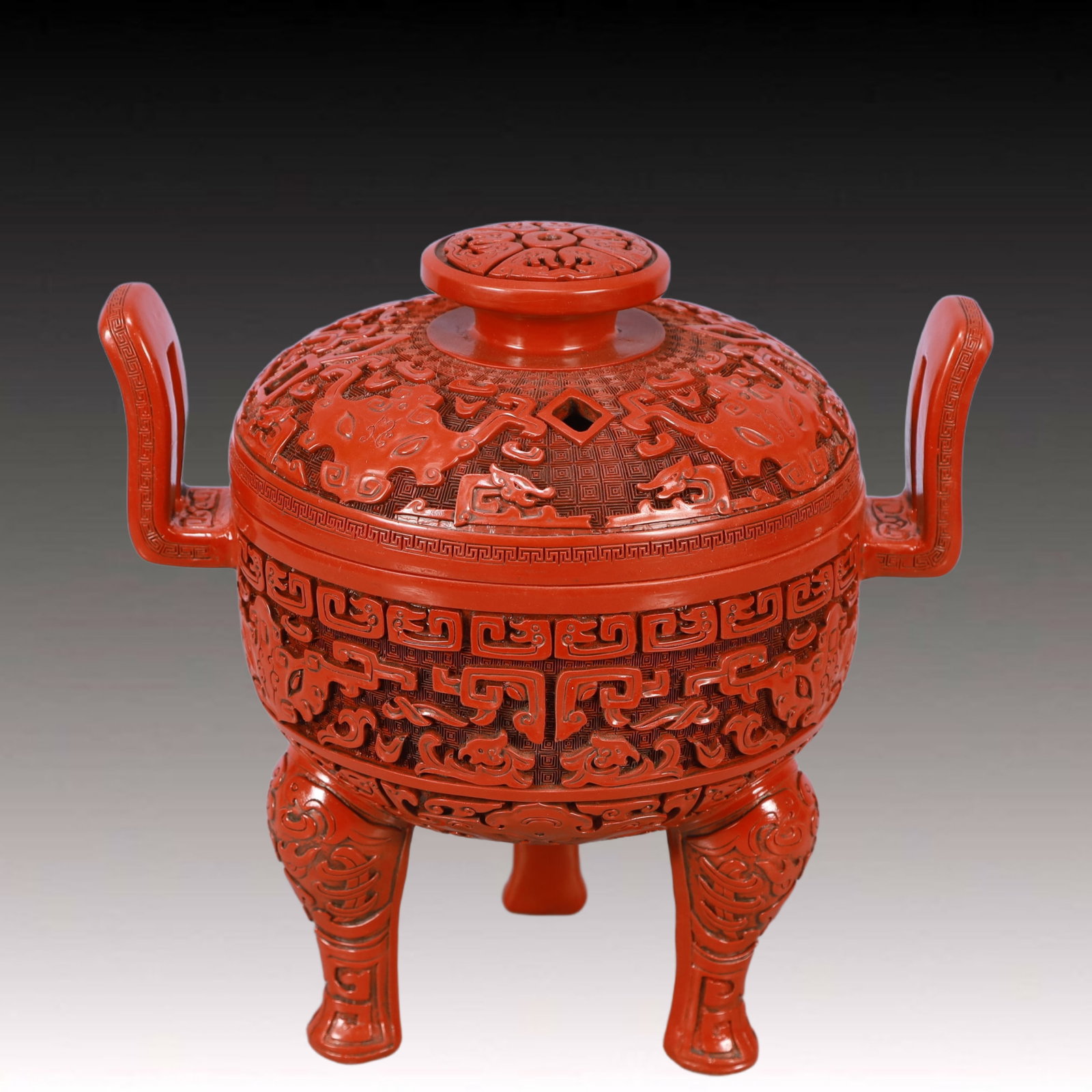 An Exquisite Carved Red Lacquer Beast-Face Pattern Double-Ears and Tripod Censer: An Exquisite Carved Red Lacquer Beast-Face Pattern Double-Ears and Tripod Censer,Qing Dynasty, China,Size:10inx7.1inx22in,Weight:1850g 剔红漆器兽面纹双&