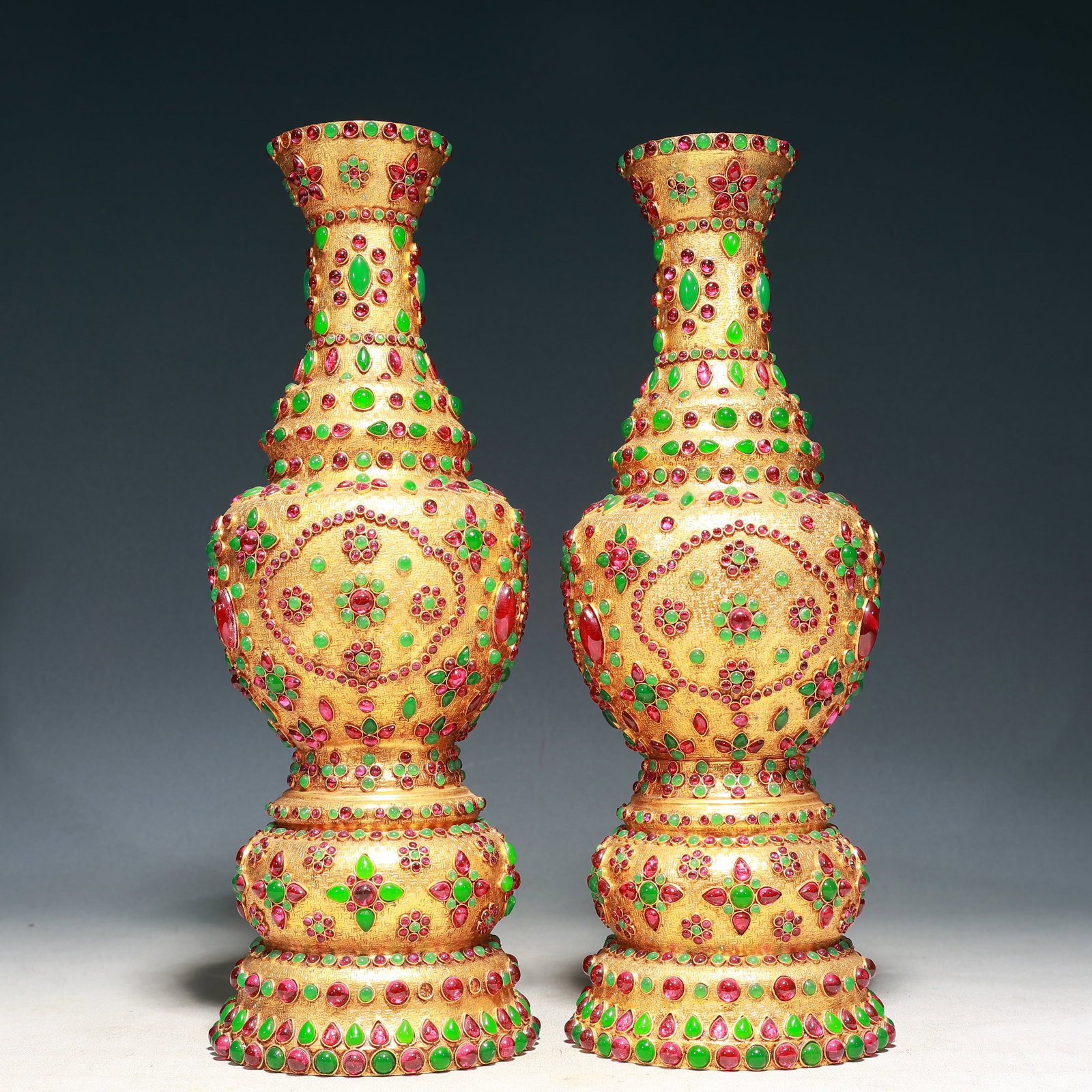 A Pair of Rare Gilt Bronze Inlaid Gems Vases: A Pair of Rare Gilt Bronze Inlaid Gems Vases,Qing Dynasty, China,Qianlong Four-character Mark,Size:4.3inx13.8in,Weight:3200g 一对铜鎏金嵌宝石瓶,&#