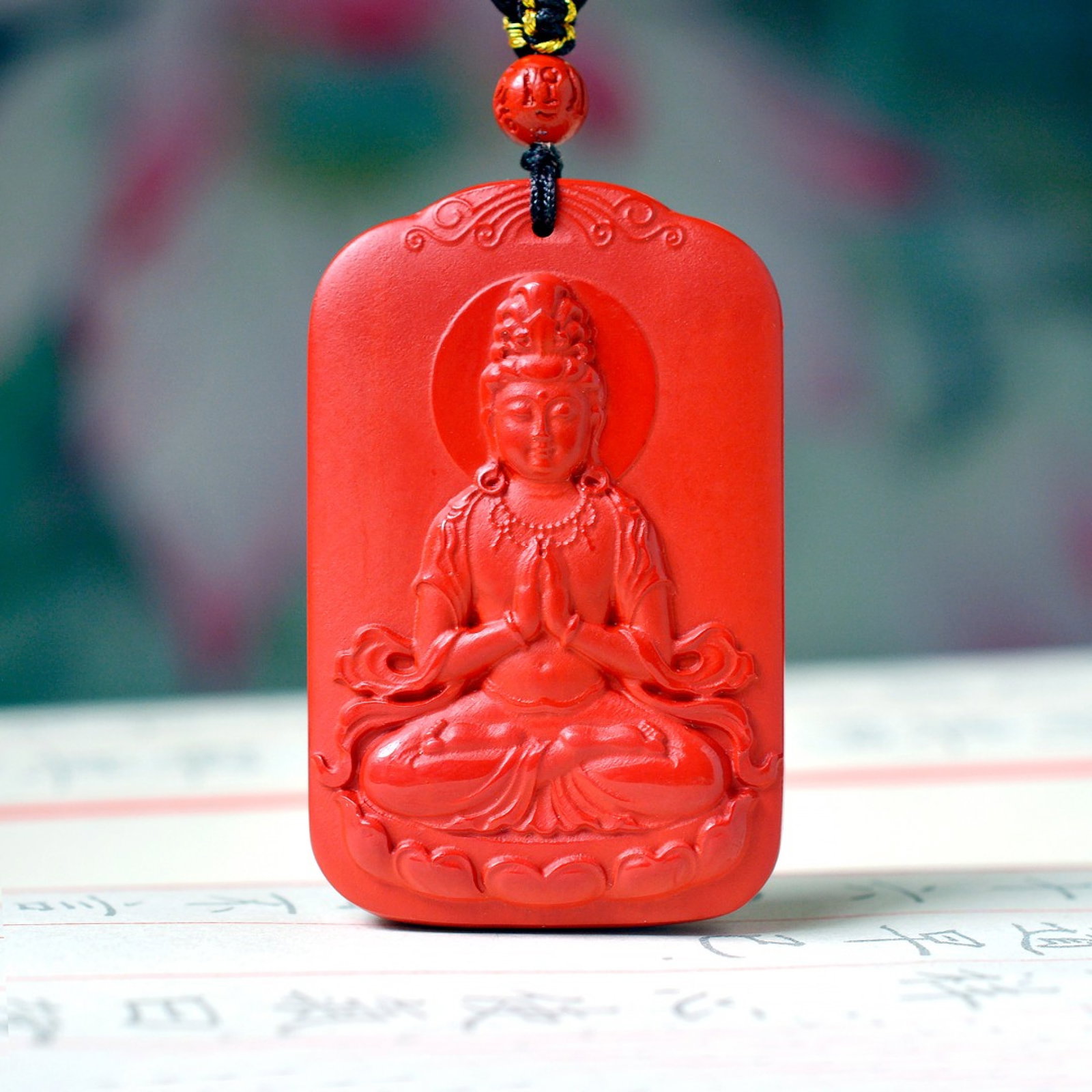An Exquisite Cinnabar Pendant with Statue of Avalokitesvara: An Exquisite Cinnabar Pendant with Statue of Avalokitesvara,Size:1.3inx2.1in,Weight:54.6g 朱砂挂件带观音像