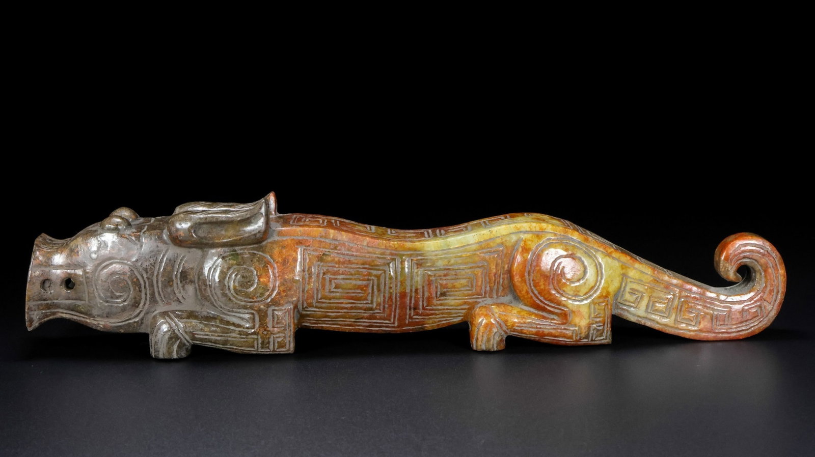 An Exquisite Archaic Jade Tiger Ornament: An Exquisite Archaic Jade Tiger Ornament,Ancient Time,China,Size:13.1inx2.6inx2in,Weight:1340g 高古玉虎摆件,中国远古时期