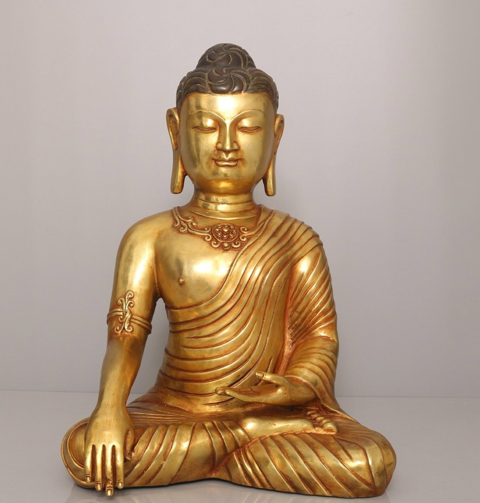 A Solemn Gilt Bronze Buddha Statue: A Solemn Gilt Bronze Buddha Statue,Ming Dynasty,China,Yongle Six-Character Mark,Size:17.7inx12.2in,Weight:10500g 铜鎏金佛像,中国明代,永È
