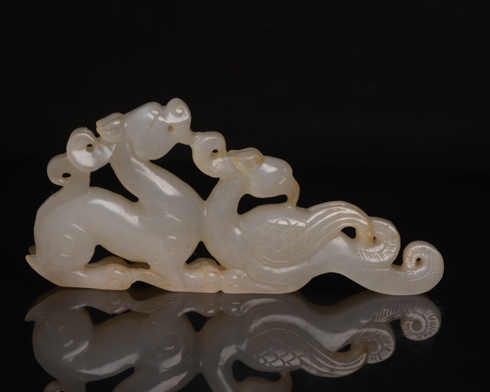 An Exquisite White Jade Dragon and Phoenix Ornament: An Exquisite White Jade Dragon and Phoenix Ornament,Qing Dynasty,China,Size:3.9inx1.8inx0.5in,Weight:68g 白玉龙凤摆件,中国清代