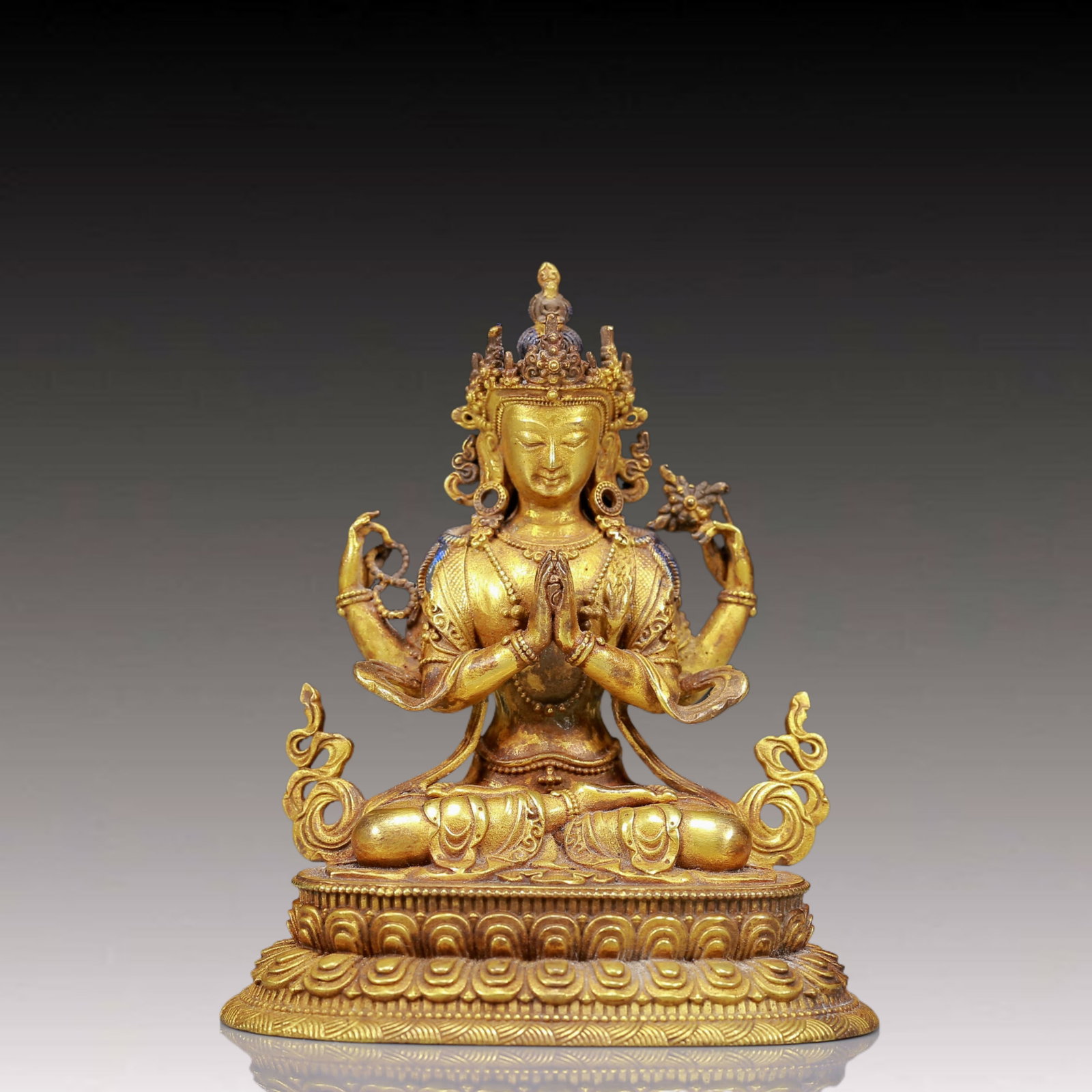 A Solemn Gilt Bronze Statue of Four-Armed Guanyin: A Solemn Gilt Bronze Statue of Four-Armed Guanyin,Ming Dynasty, China,Size:3.3inx2.4inx3.9in,Weight:315g 铜鎏金四臂观音像，明代