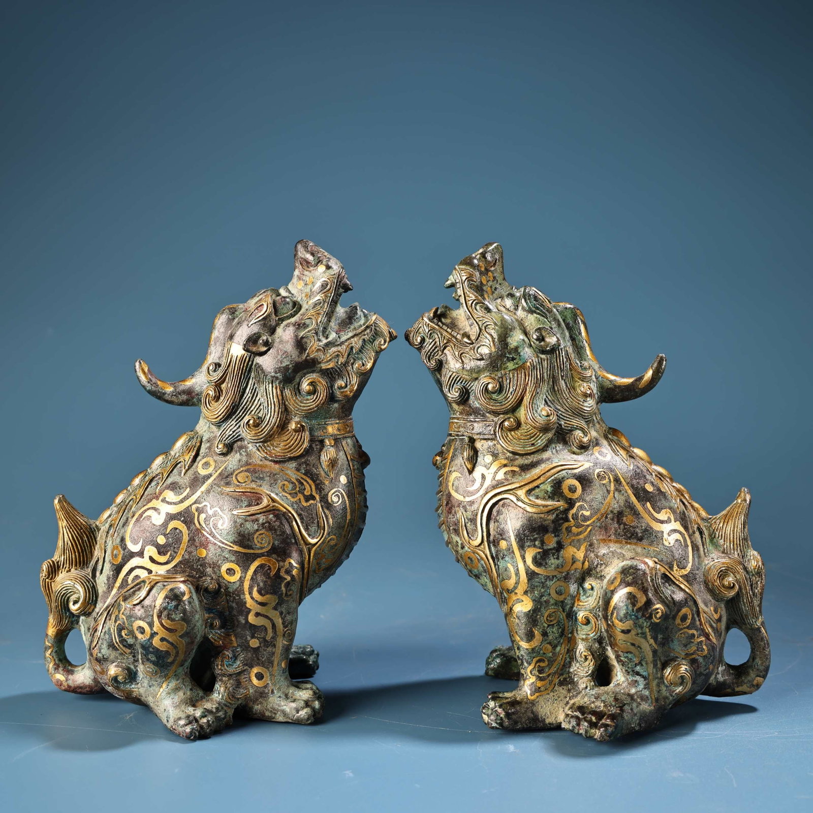 A Pair of Exquisite Bronze Inlaid Gold Beast Ornaments: A Pair of Exquisite Bronze Inlaid Gold Beast Ornaments,the Warring States period in China,Size:6.3inx4.5in,Weight:1200g 一对青铜错金兽摆件,中