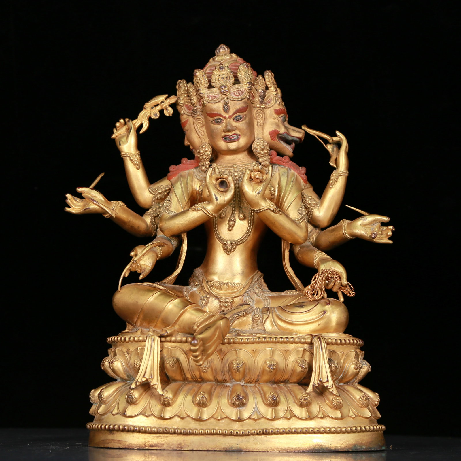 An Elaborate Gilt-Bronze Figure Of Dakini: An Elaborate Gilt-Bronze Figure Of Dakini Seated with an upset expression, body adorned with jewelry ornaments, topknot surmounted by a splendid diadem, hands brandishing ritual items. Chinese Ming Dy