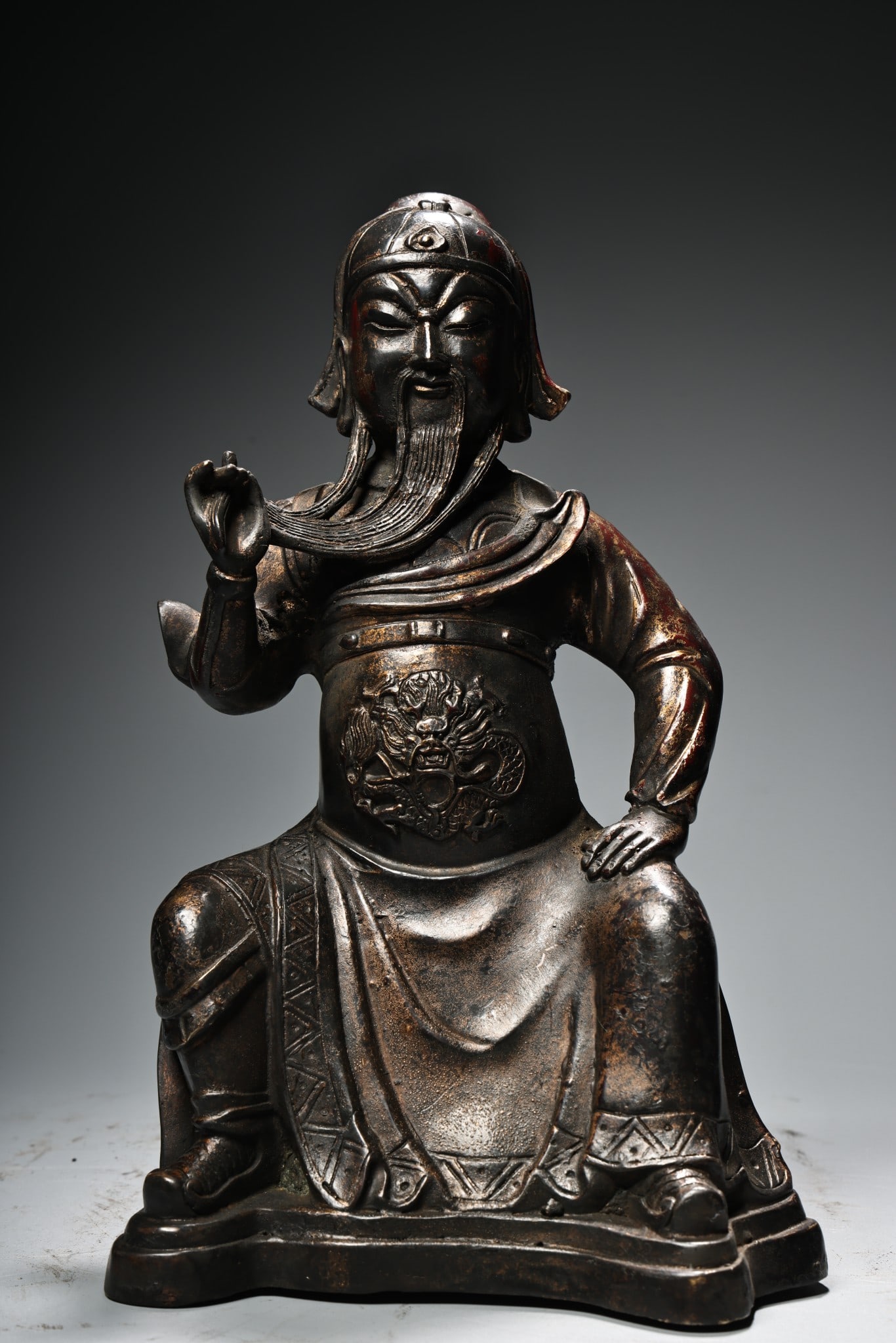 A Solemn Gilt Bronze Dragon Pattern Statue of Guangong: A Solemn Gilt Bronze Dragon Pattern Statue of Guangong,Qing Dynasty, China,Size:9.8inx5.9in,Weight:1000g铜鎏金龙纹关公像,中国清代