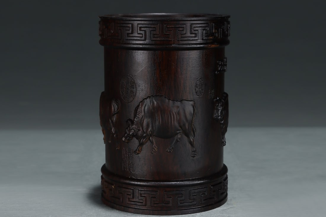 An Exquisite Eaglewood Buffalo Pattern Brush Pot: An Exquisite Eaglewood Buffalo Pattern Brush Pot,Qing Dynasty,ChinaSize:5.8inx4.1in沉香木牛纹笔筒,中国清代,Size:14.8cmx10.3cm