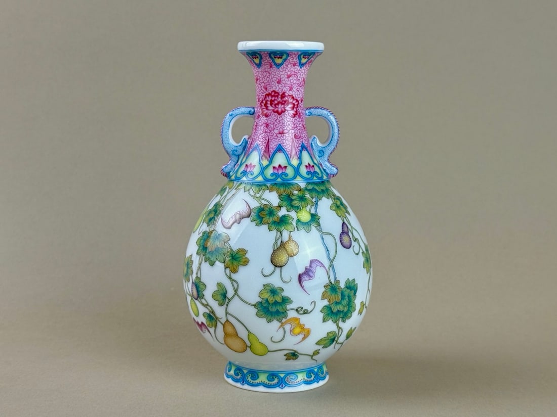 An Exquisite Famille-Rose Bats and Gourd Pattern Double-Ears Vase: An Exquisite Famille-Rose Bats and Gourd Pattern Double-Ears Vase,Qing Dynasty,China,Qianlong Four-character Mark,Size:6.7inx3.6inx2.1in粉彩蝙蝠葫芦纹双