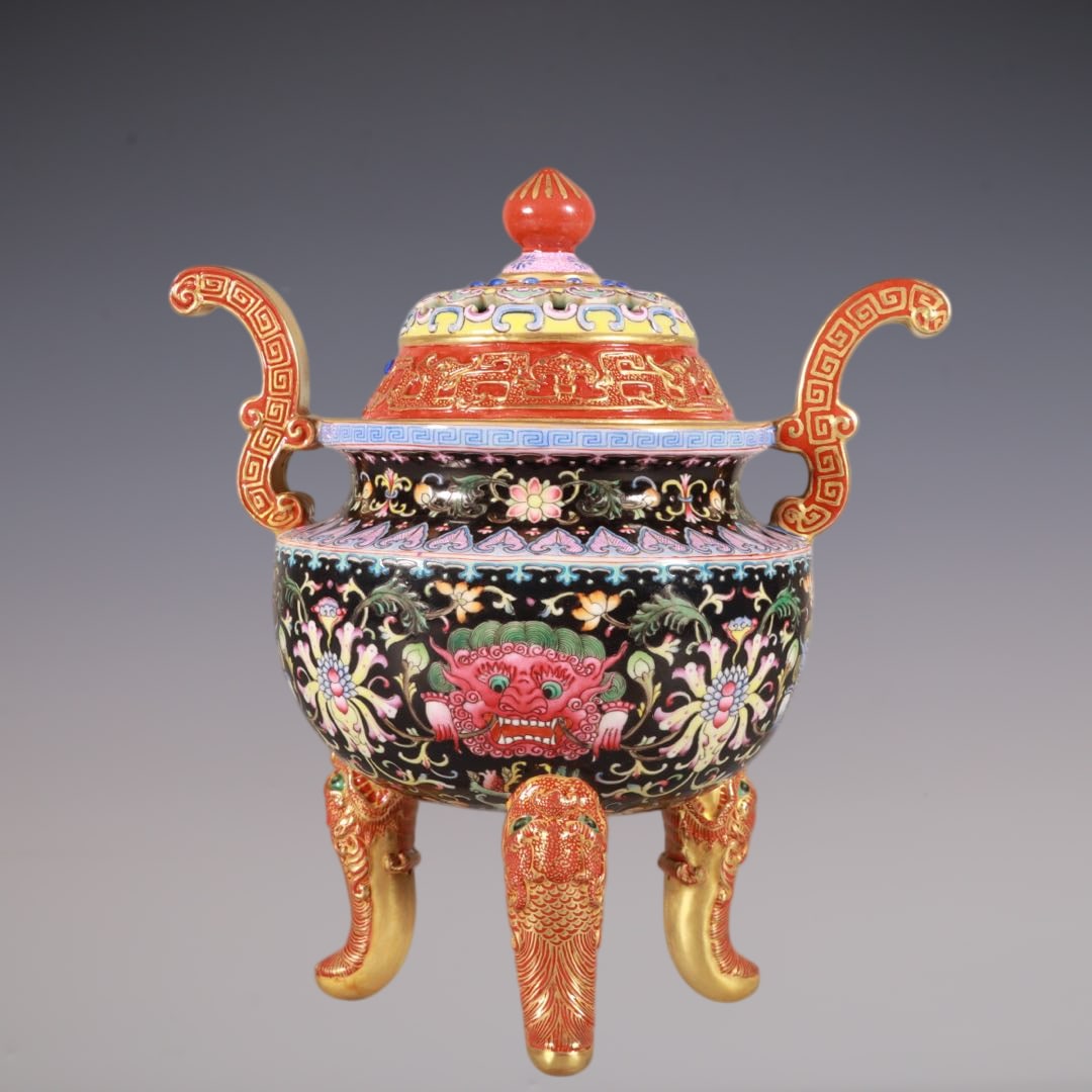 An Exquisite Enamel Beast-Face Pattern Lotus Pattern Double-Ears and Tripod Censer: An Exquisite Enamel Beast-Face Pattern Lotus Pattern Double-Ears and Tripod Censer Qing Dynasty, China Qianlong Six-character Mark Size:8.3inx6.9in珐琅彩雕刻黑ß