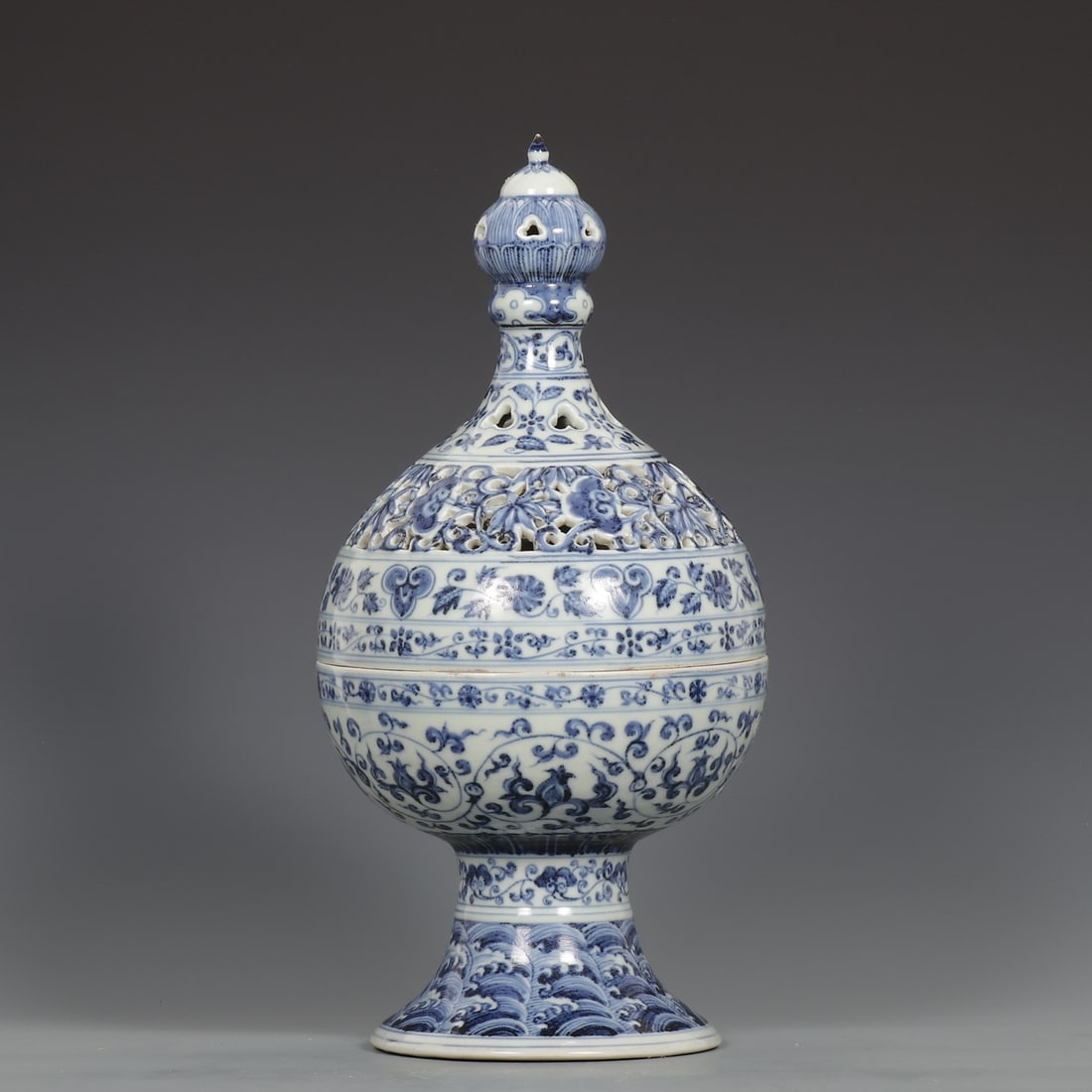 A Rare Blue and White Hollow Lotus and Seawater Pattern Censer: A Rare Blue and White Hollow Lotus and Seawater Pattern Censer,Ming Dynasty, ChinaSize:15.2inx7.3in青花镂空缠枝莲海水纹香炉,