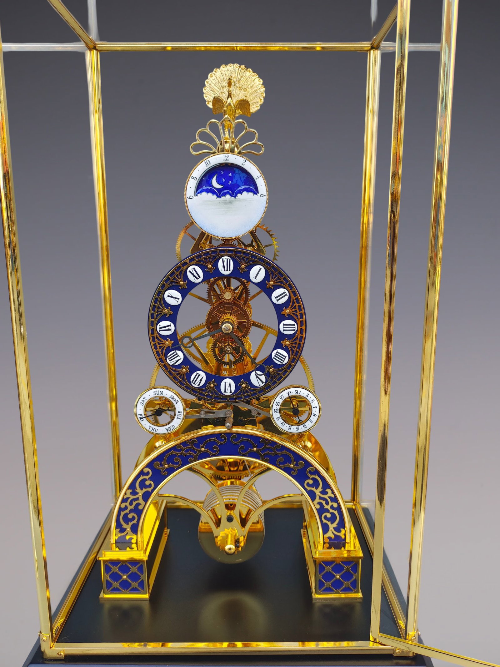 An Exquisite Gilt Bronze Lotus Pattern Clock: An Exquisite Gilt Bronze Lotus Pattern Clock Size:22.8inx12.6inx10.2in铜鎏金缠枝莲纹钟表 Size:58cmx32cmx26cm