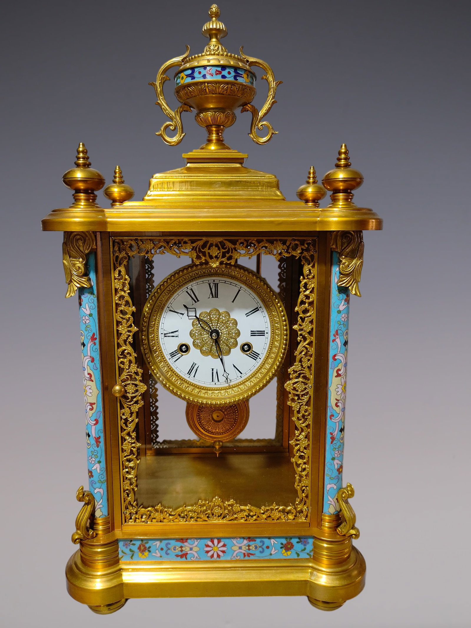 An Exquisite Gilt Bronze Lotus Pattern Clock: An Exquisite Gilt Bronze Lotus Pattern Clock Size:24.4inx12.6inx8.7in铜鎏金缠枝莲纹钟表 Size:62cmx32cmx22cm
