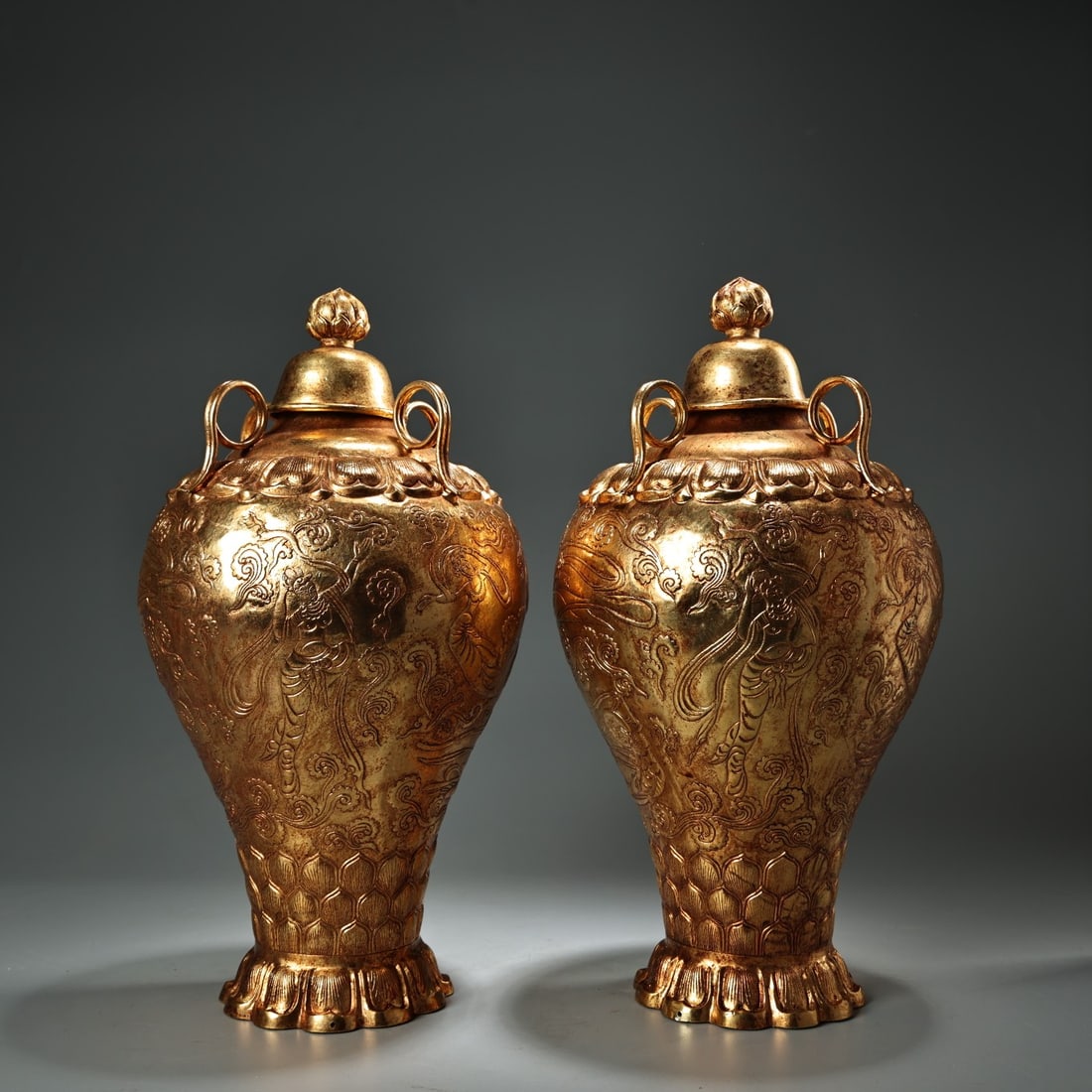 A Pair of Rare Gilt Bronze Figure Pattern Bottles: A Pair of Rare Gilt Bronze Figure Pattern Bottles,Qing Dynasty, China,Size:11.8inx5.5in,Weight:1500g一对铜鎏金人物纹盖瓶,中国