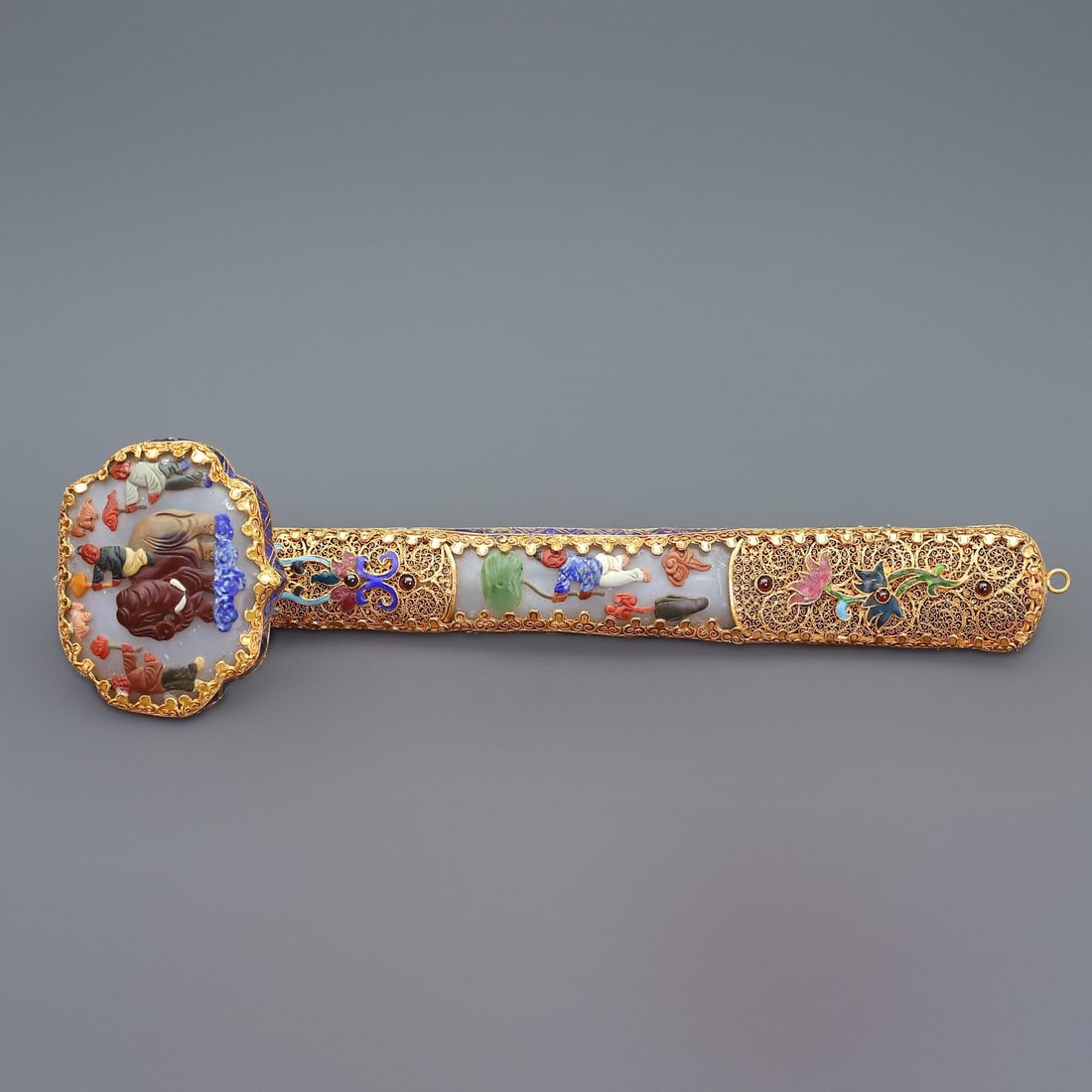 A Rare Filigree and Gilding Inlaid White Jade Figure Pattern Ruyi,Inlaid Gems: A Rare Filigree and Gilding Inlaid White Jade Figure Pattern Ruyi,Inlaid Gems,Qing Dynasty,China,Qianlong Four-character Mark,Size:3.9inx15.2inx5.7in,Total Weight:1920g花丝鎏金