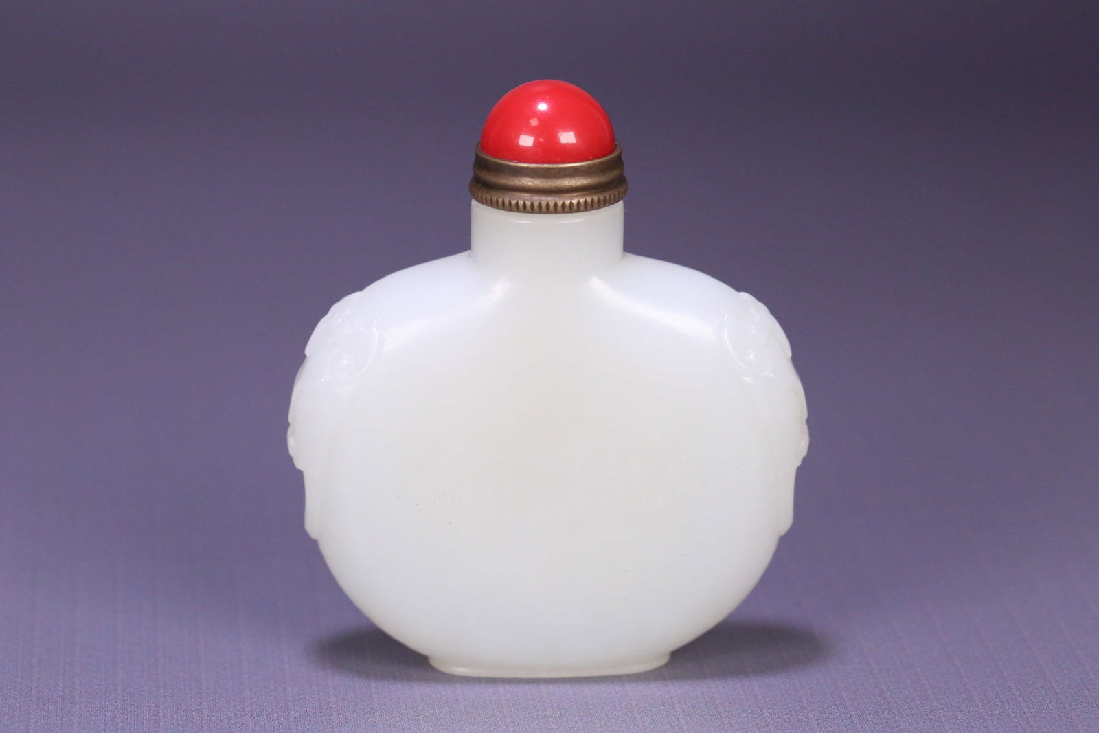 An Exquisite White Jade Beast-Ears Snuff Bottle: An Exquisite White Jade Beast-Ears Snuff Bottle,Qing Dynasty, ChinaSize:2.4inx2.2inx0.6in,Weight:77.2g白玉兽耳鼻烟壶,中国清代,Size:6.2